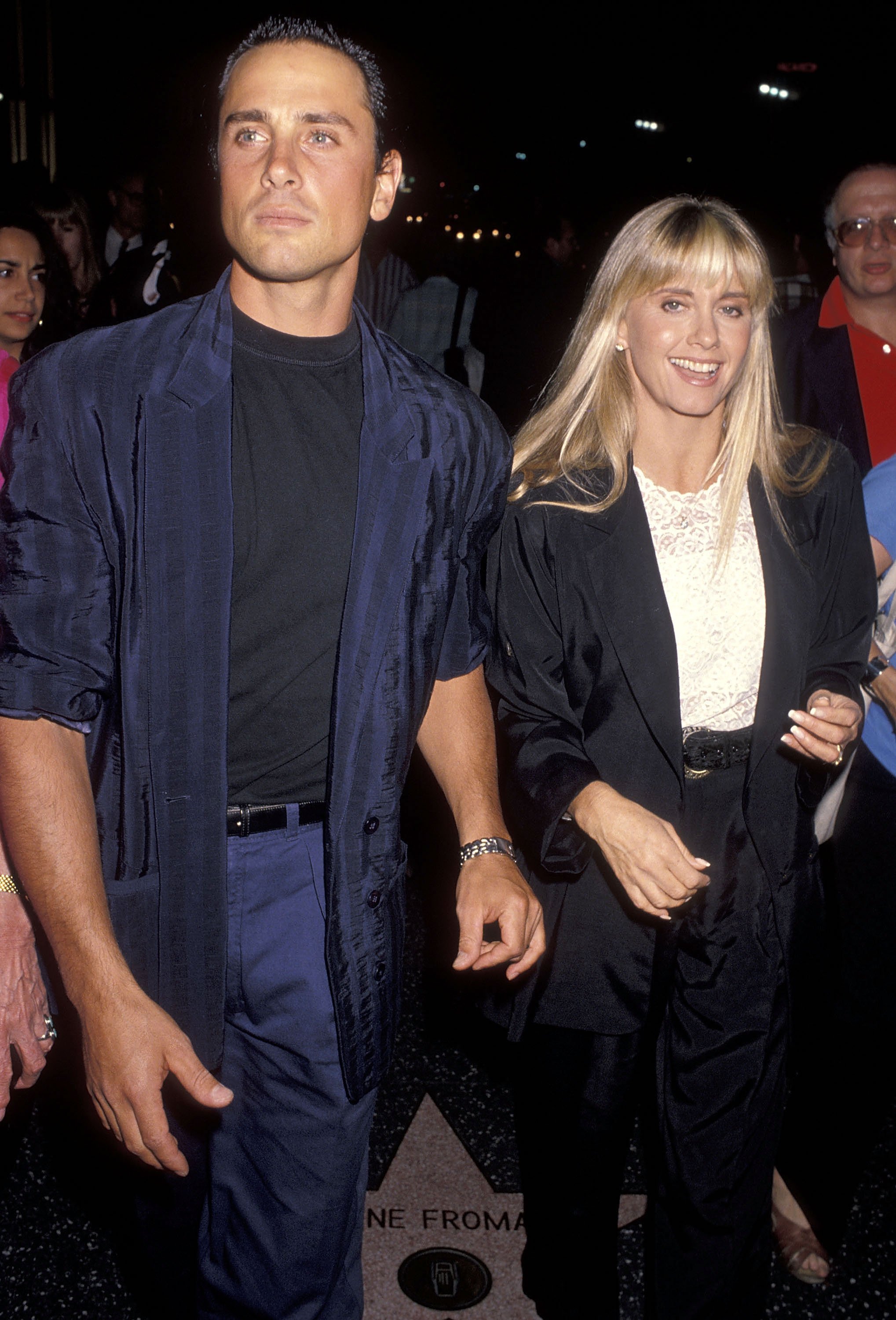 Singer Olivia Newton-John and husband Matt Lattanzi attend the "Out There Tonight" Opening Night Performance on August 29, 1990 at the Pantages Theatre in Hollywood, California. | Source: Getty Images