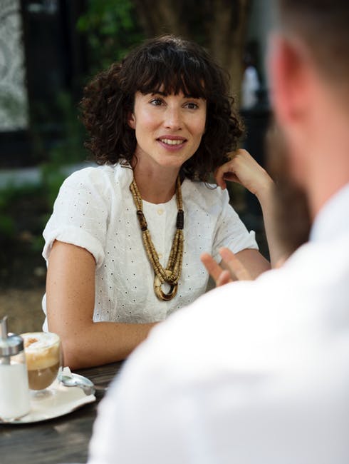 A woman staring at a man during a coffee date. | Source: Pexels