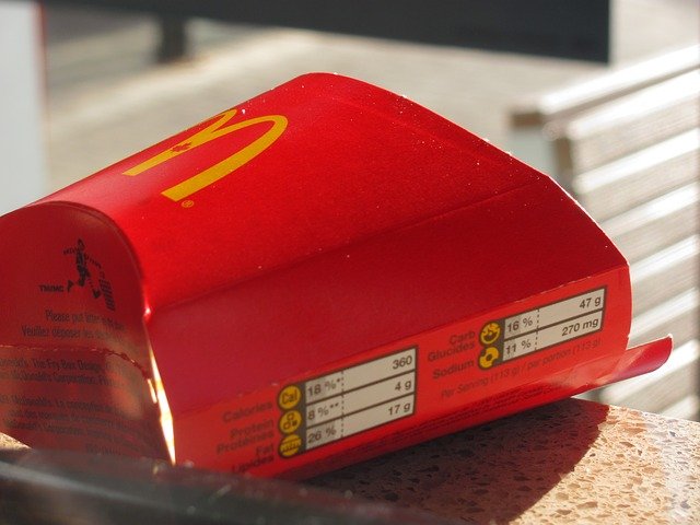 A McDonald's empty fries box on a table | Photo: Pixabay