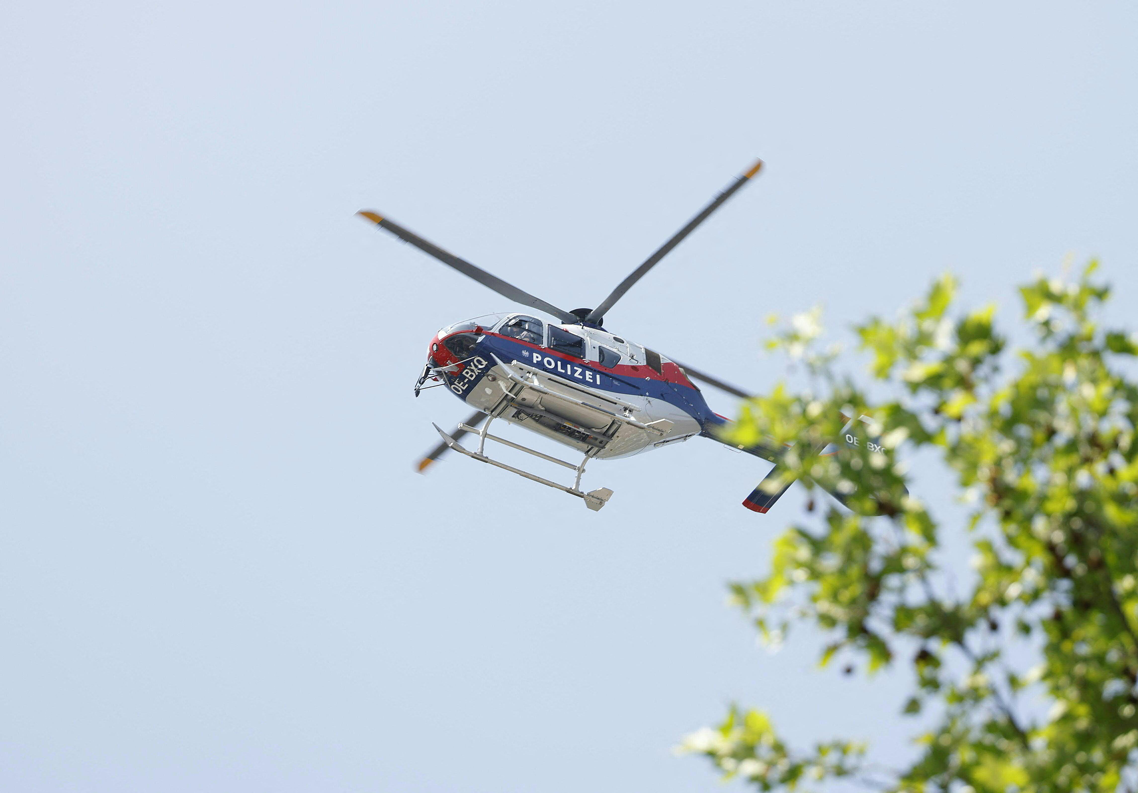 A police helicopter is seen in the air. | Source: Getty Images
