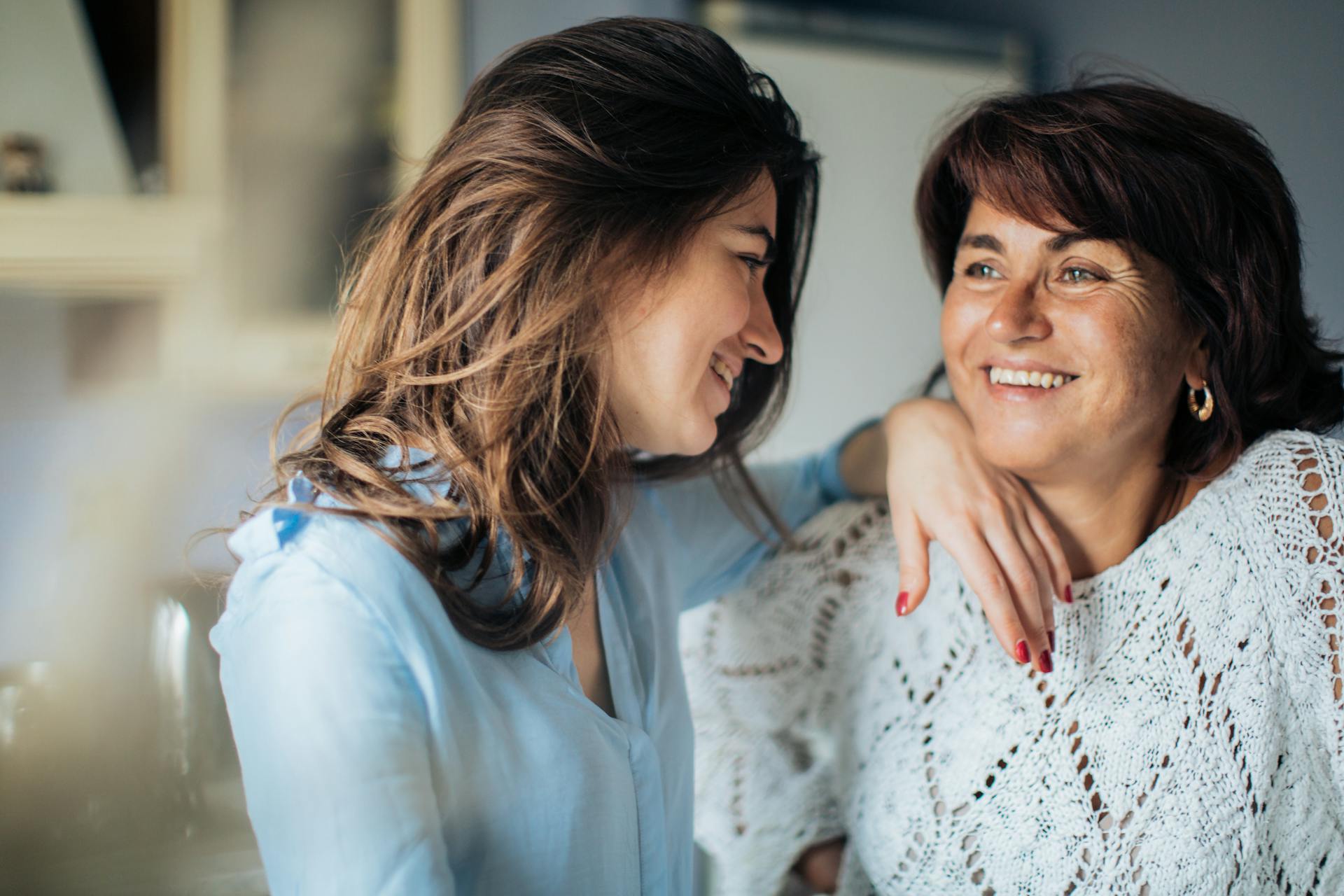 A woman smiling at her mother | Source: Pexels