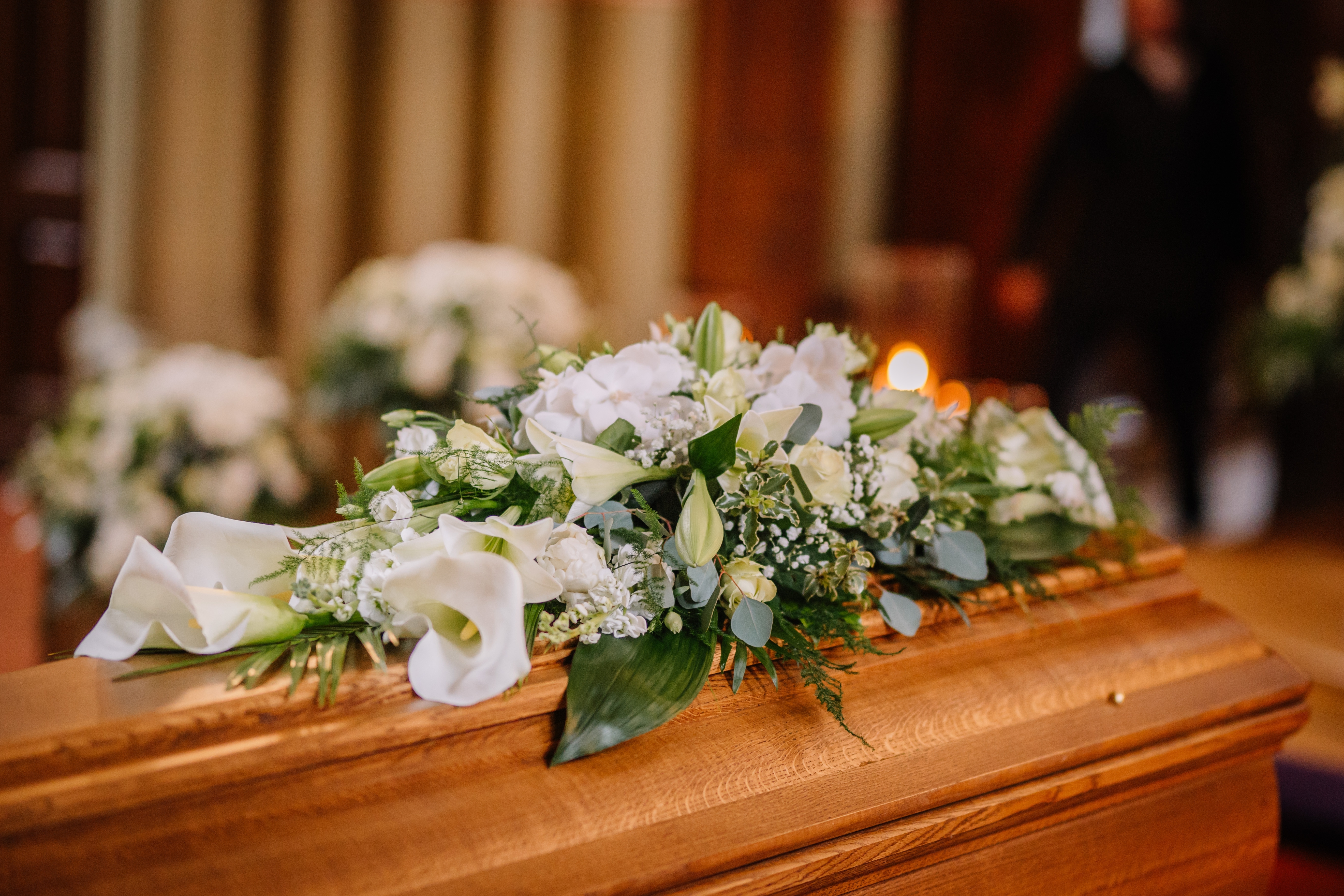 Coffin with flowers on | Shutterstock