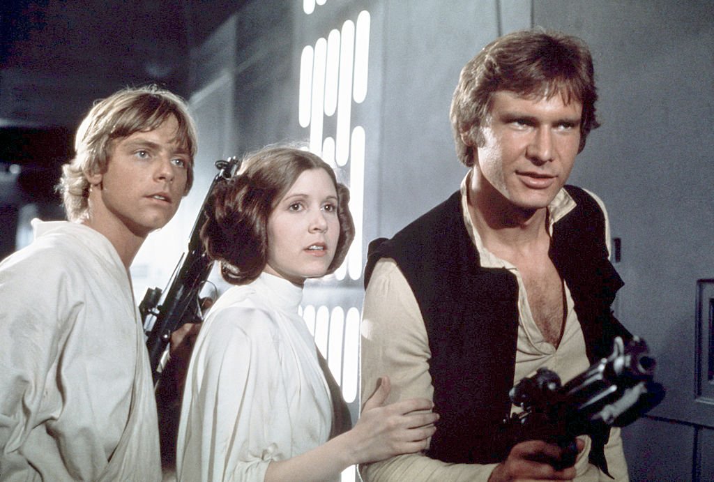 Mark Hamill, Carrie Fisher and Harrison Ford on the set of "Star Wars." | Source: Getty Images