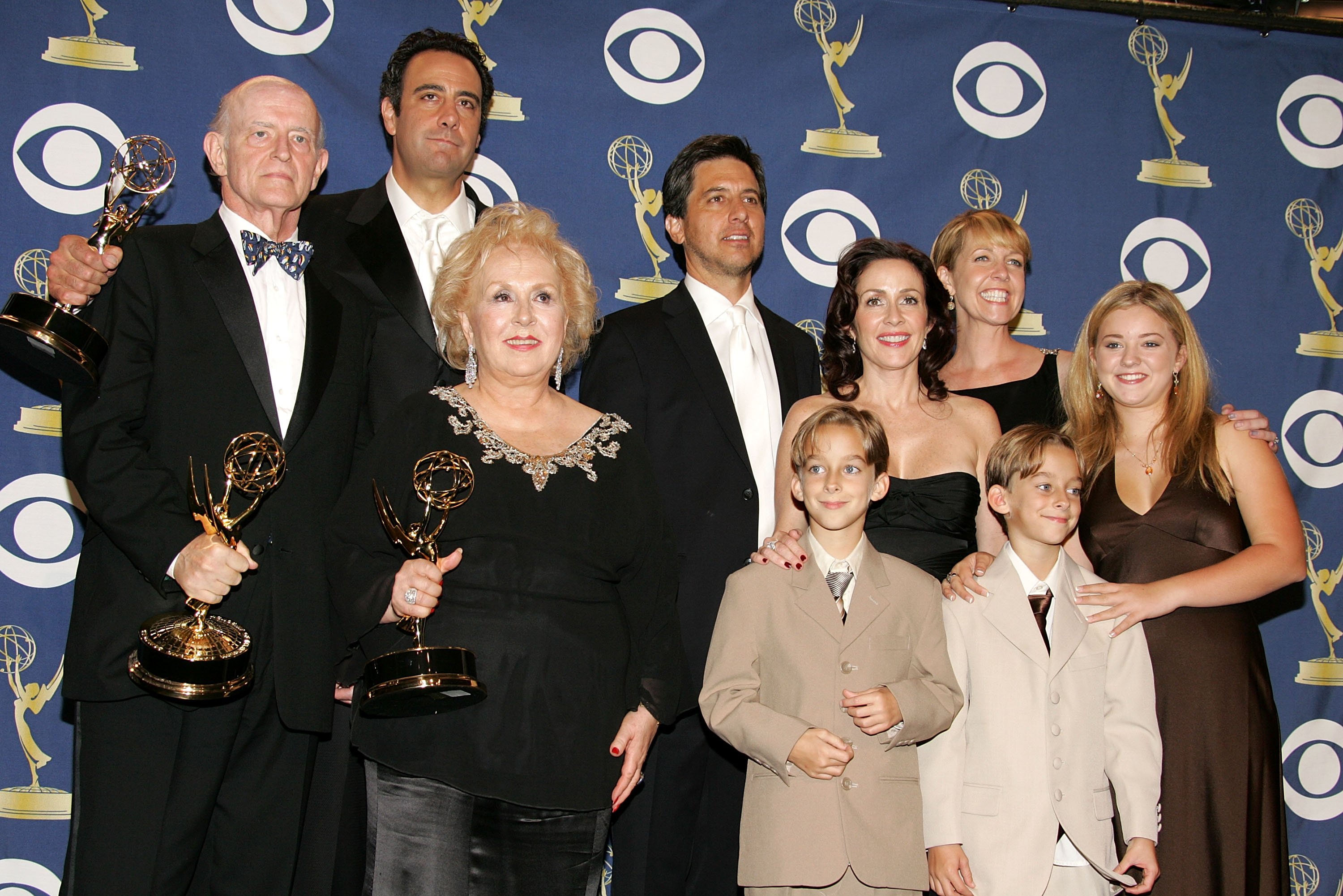 The cast of 'Everybody Loves Raymond', (L-R) Peter Boyle, Brad Garrett, Doris Roberts, Ray Romano, Patricia Heaton, Monica Horan, Sawyer Sweeten, Sullivan Sweeten and Madylin Sweeten pose with the Emmy for Outstanding Comedy Series in the press room at the 57th Annual Emmy Awards held at the Shrine Auditorium on September 18, 2005 in Los Angeles, California. | Source: Getty Images