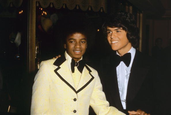 Michael Jackson (1958 - 2009) with Donny Osmond at the American Music Awards in Hollywood, 19th February 1974 | Photo: Getty Images
