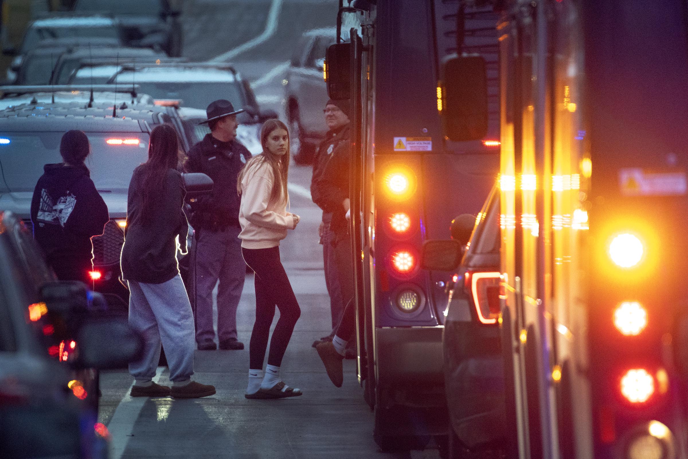 Students escorted from a church next to the Abundant Life Christian School on December 16, 2024, in Madison, Wisconsin. | Source: Getty Images