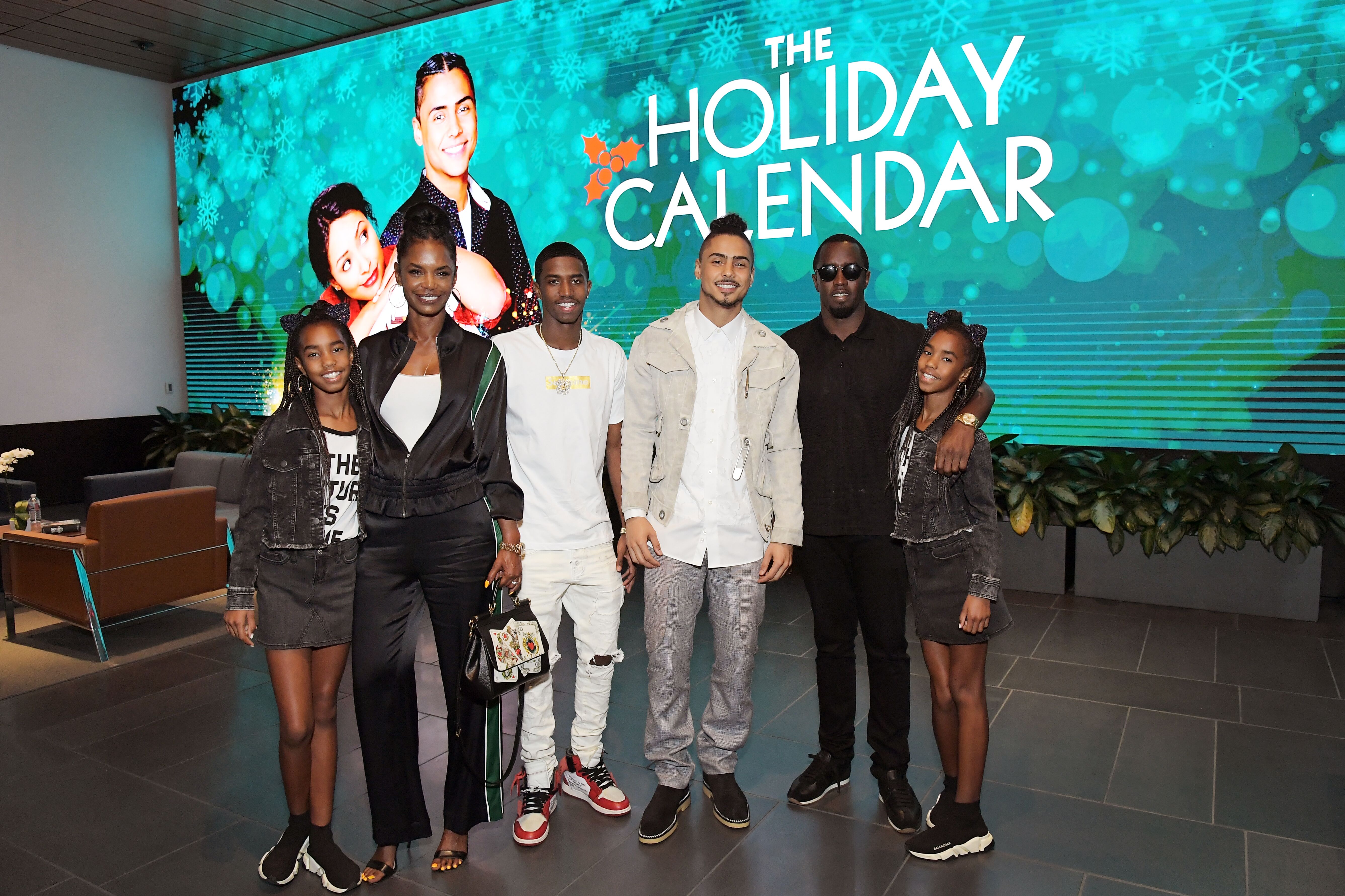 Quincy Brown at the 2018 premiere of "Holiday Calendar" with his mom Kim Porter and his siblings/ Source: Getty Images
