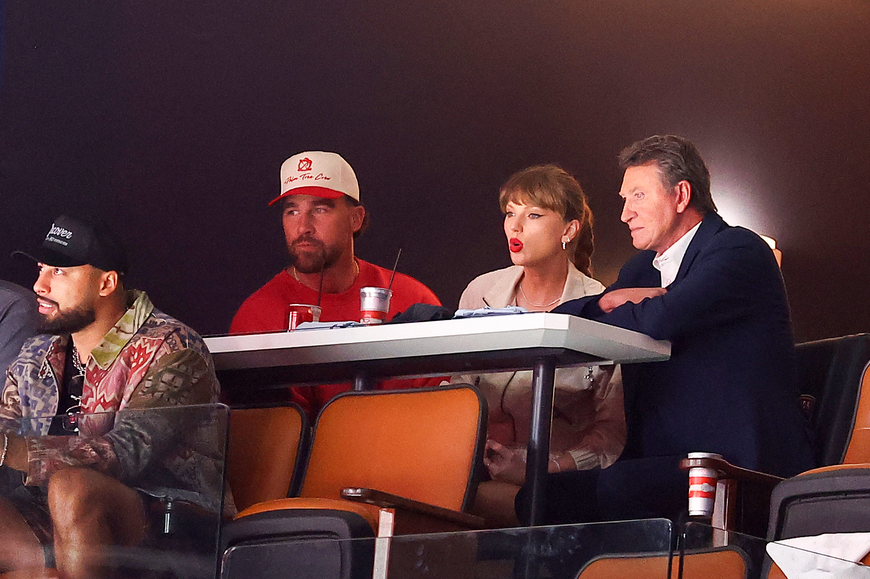 Travis Kelce, Taylor Swift, and Wayne Gretzky during the second period of Game Four of the 2025 Stanley Cup Final at Amerant Bank Arena on June 12, 2025, in Sunrise, Florida | Source: Getty Images