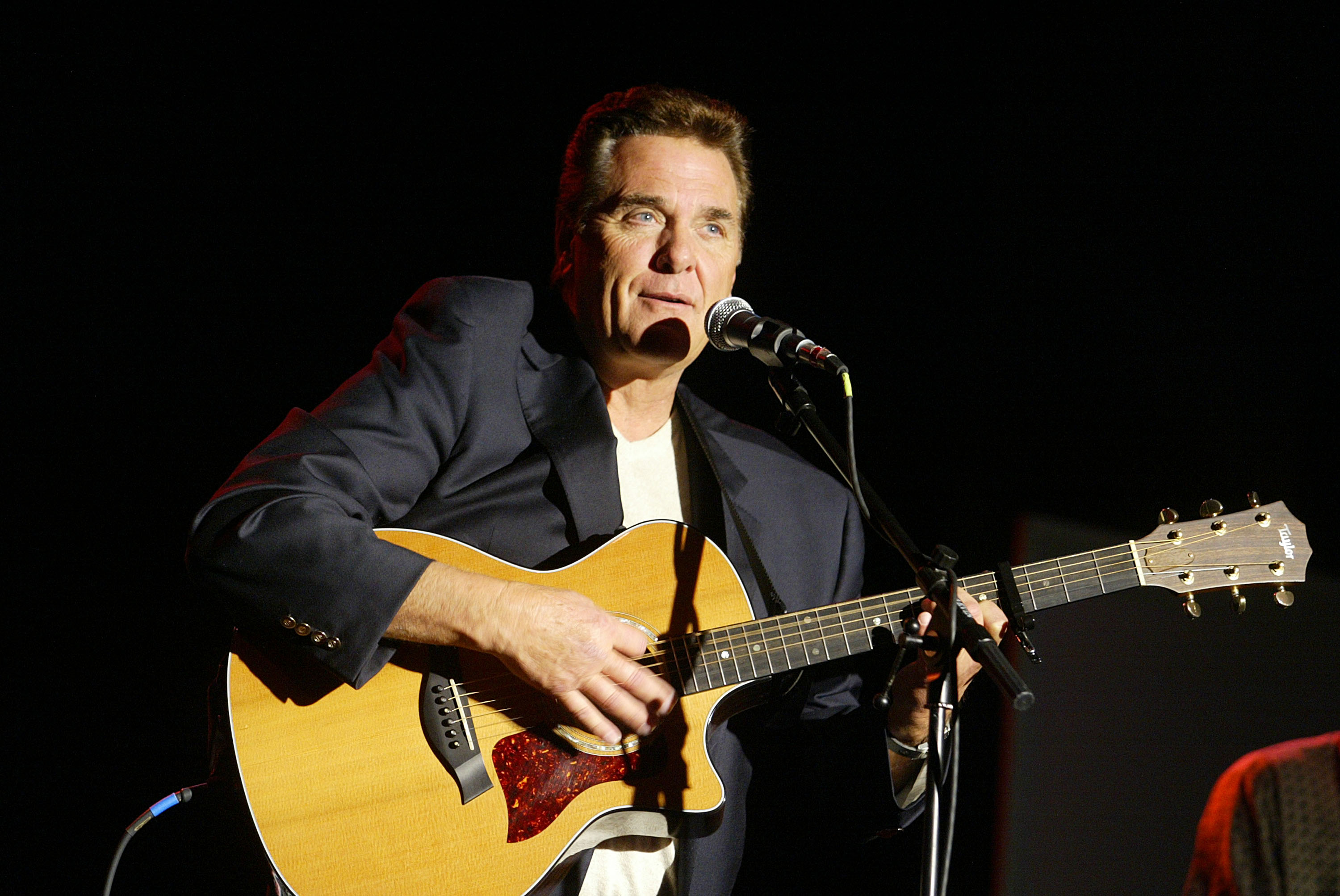 Chuck Woolery, "Lingo" and "Love Conection", performs at the "Game Show Networks 2003 Winter TCA Tour" at the Renaissance Hotel in Los Angeles on Wednesday, on January 8, 2003. | Source: Getty Images