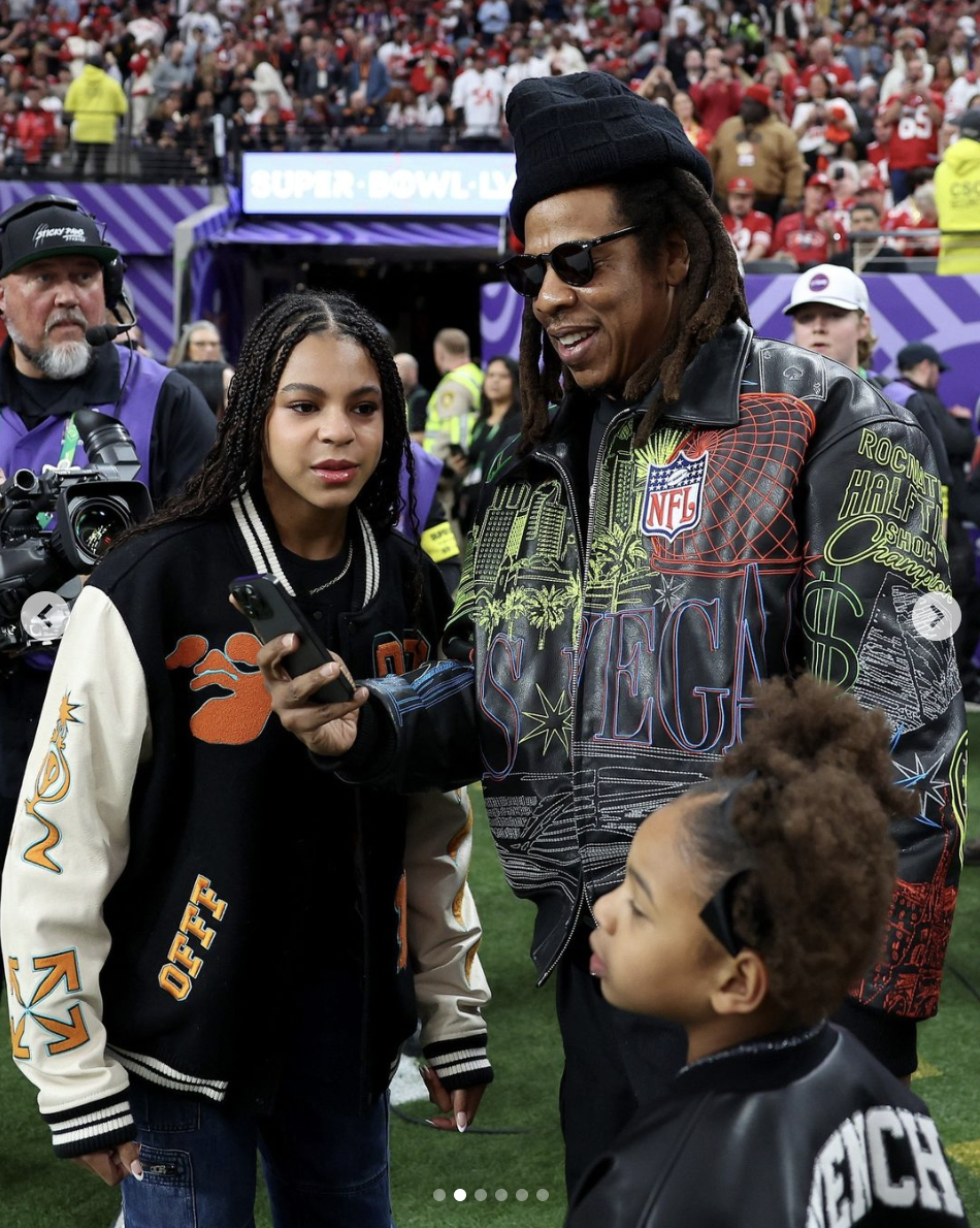 Blue Ivy, Jay-Z, and Rumi Carter at the 2024 Super Bowl, dated February 2024 | Source: Instagram/ENews