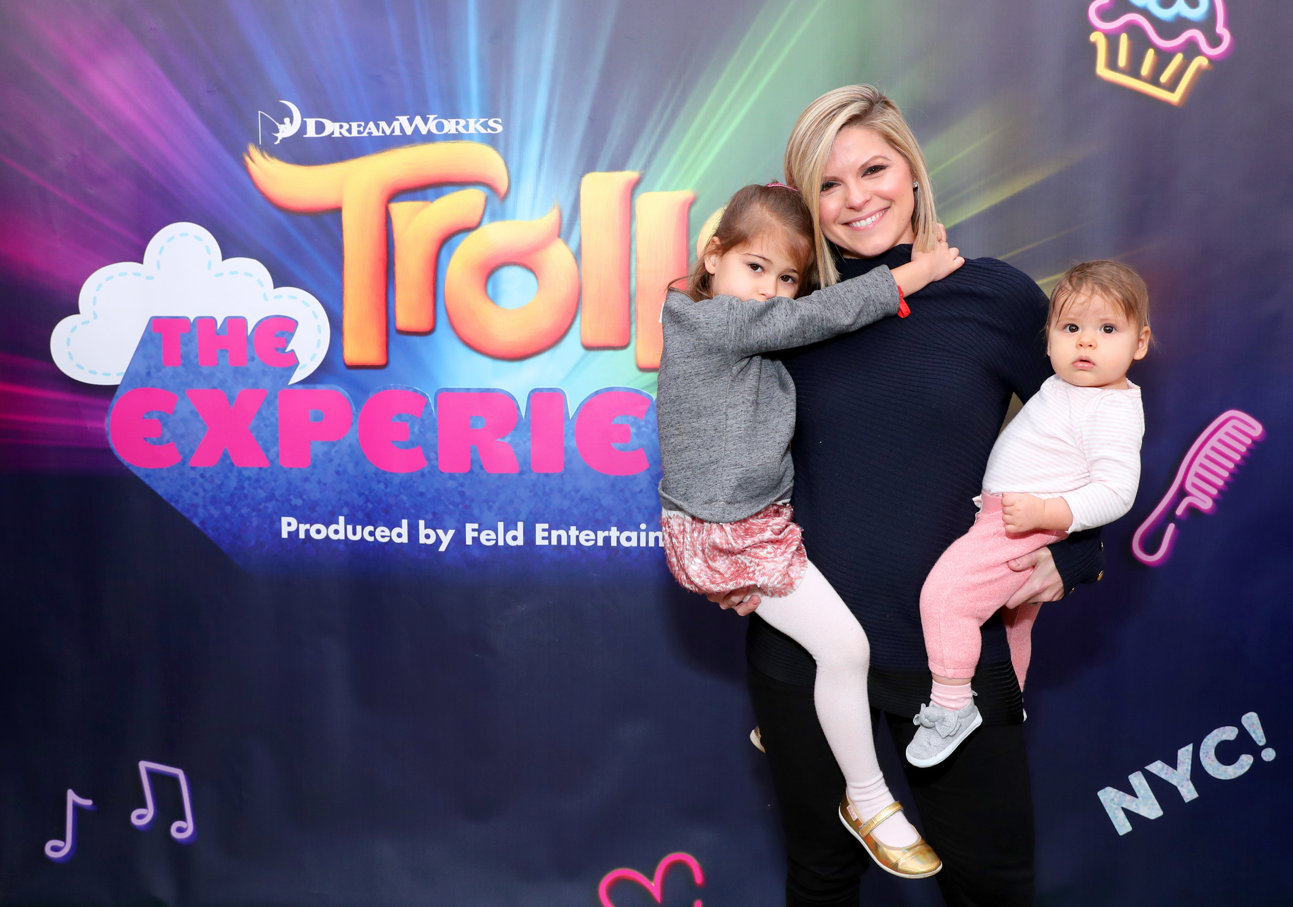 Kate Bolduan and her daughters, Cecilia and Delphine Esther, attend the opening of the DreamWorks Trolls The Experience Rainbow Carpet on November 14, 2018, in New York City. | Source: Getty Images