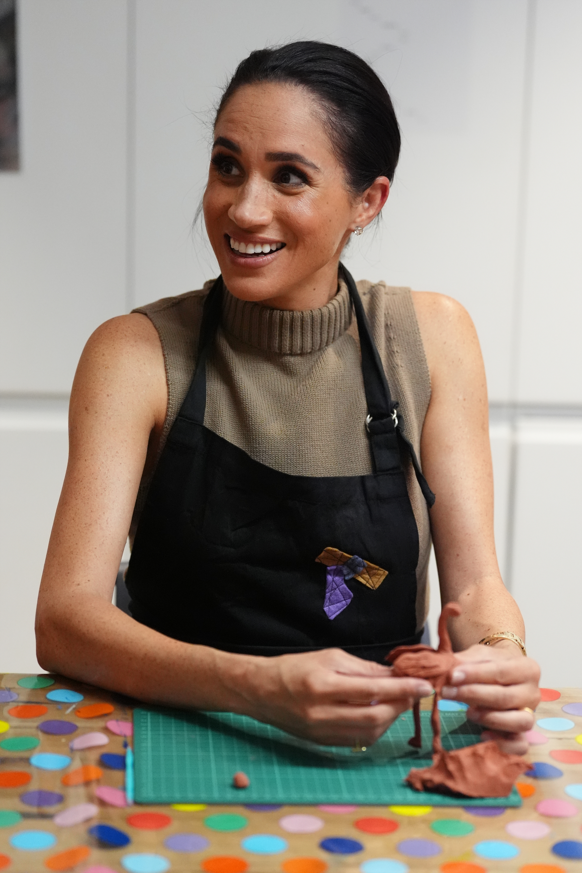 Meghan, Duchess of Sussex takes part in a model making activity with veterans and their families at the Australian National Veterans Arts Museum (Anvam) in Southbank on 14 April 2026 in Melbourne, Australia. | Source: Getty Images