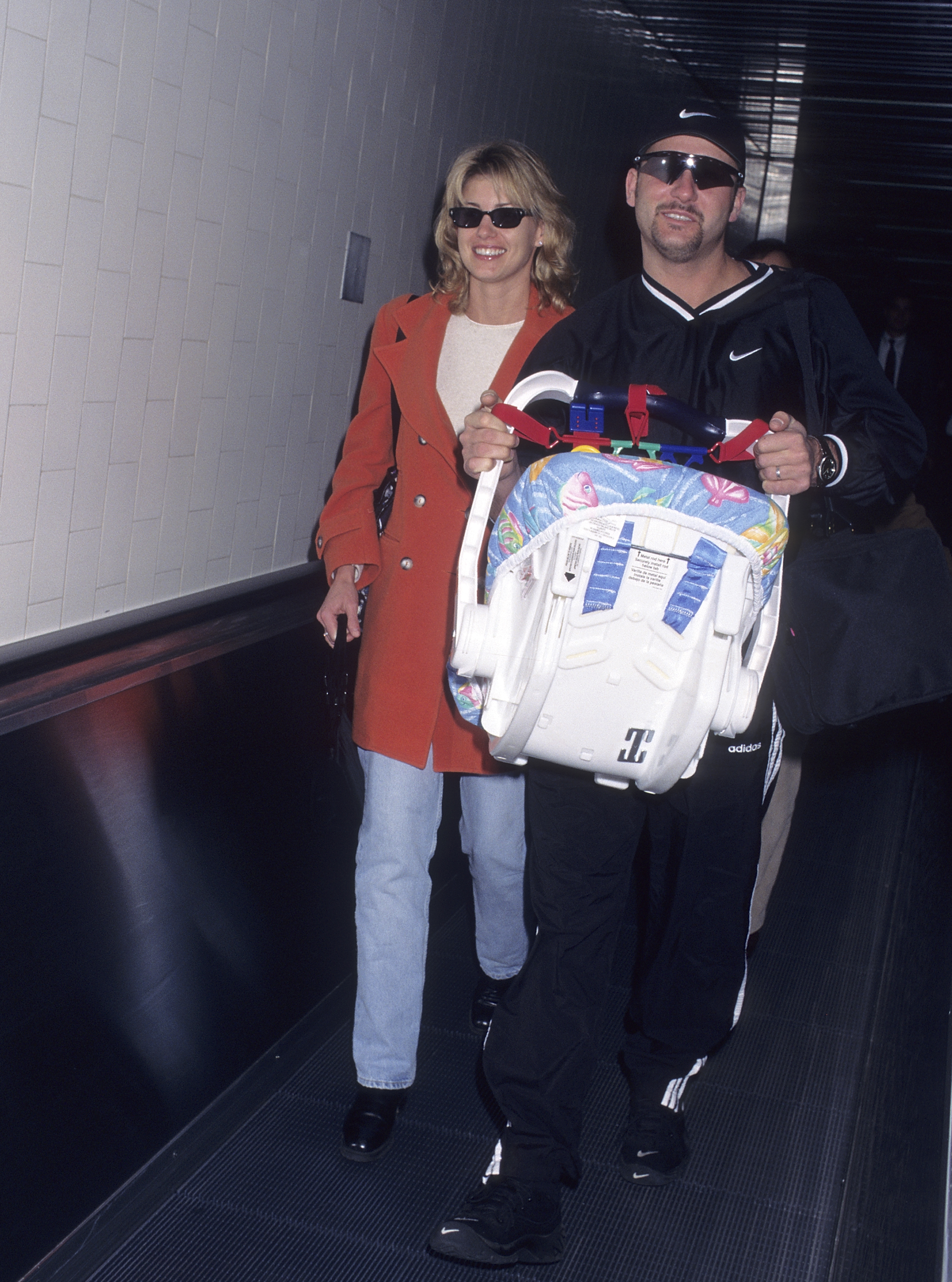 Tim McGraw and Faith Hill arrive with newborn daughter Gracie. Over the years, Tim has said that raising their three daughters is his greatest accomplishment, praising each for forging her own path—including Gracie, whom he once described as a "strong, independent young lady." | Source: Getty Images