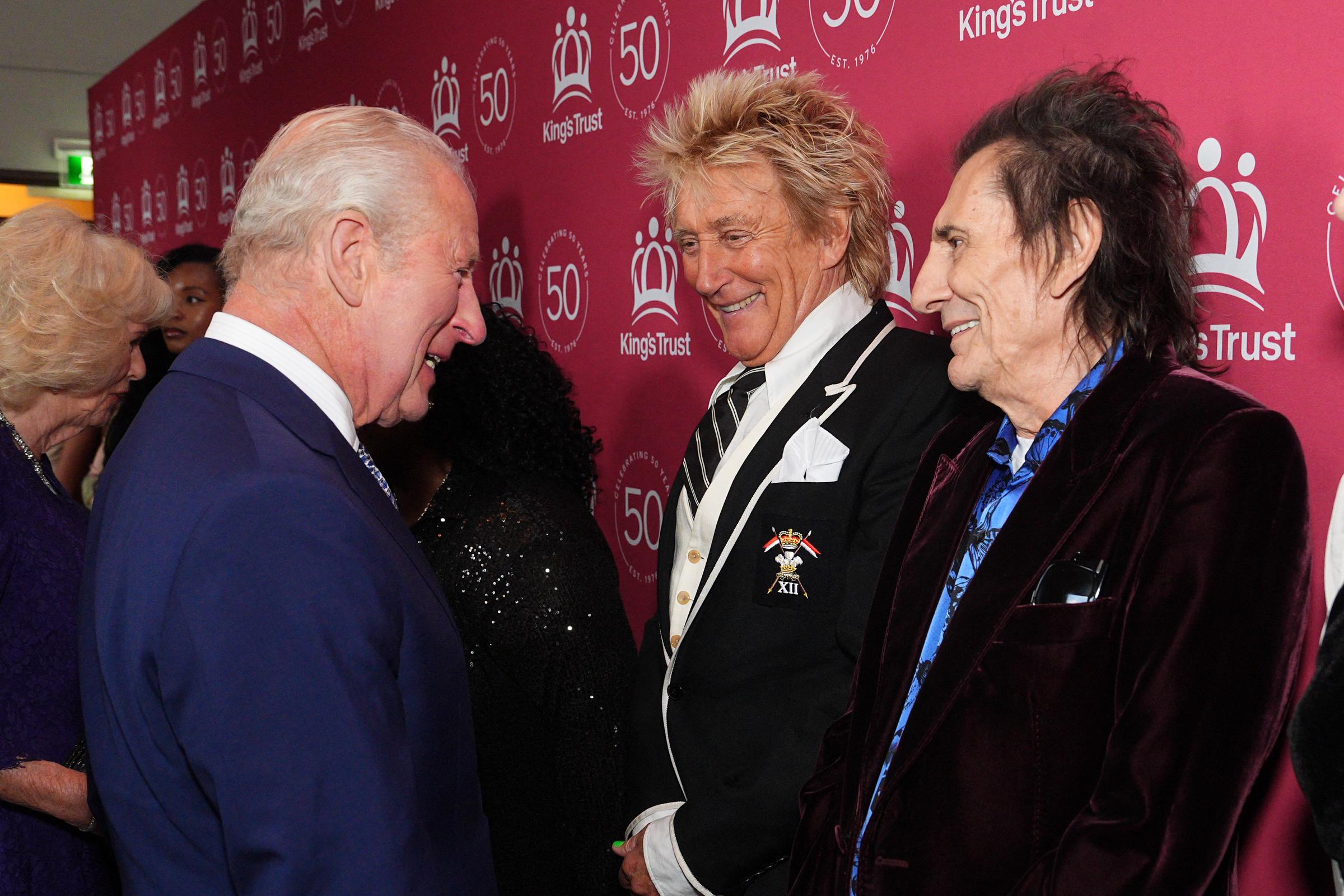 King Charles III engaging with Rod Stewart and Ronnie Wood at the A King's Trust celebration at the Royal Albert Hall. | Source: Getty Images