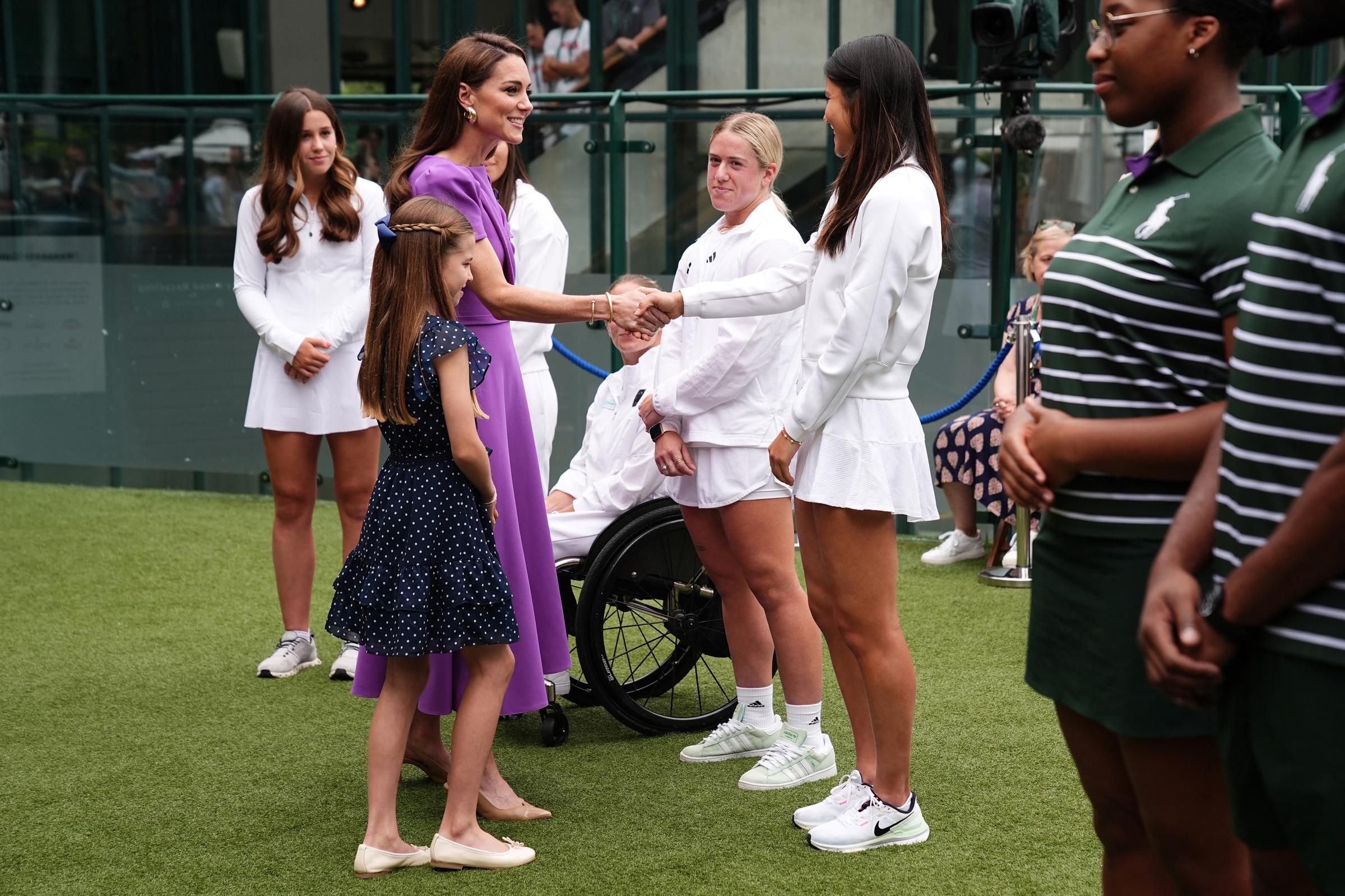 Kate Middleton and Princess Charlotte greet Emma Raducanu on July 14, 2024, in London, England. | Source: Getty Images