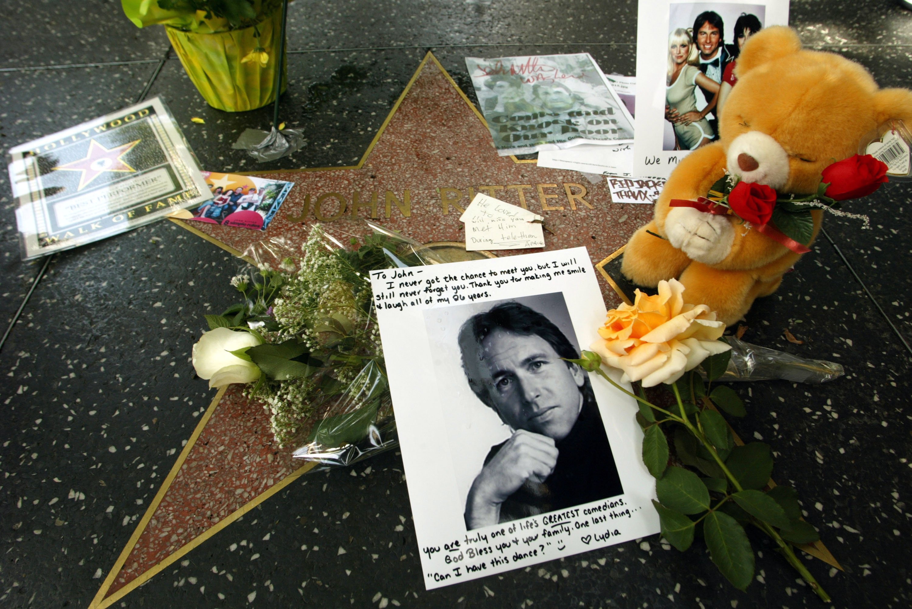 John Ritter's Star on the Hollywood Walk of Fame Memorialized with Flowers and Gifts by Fans after his death on September 11, 2003 | Source: Getty Images