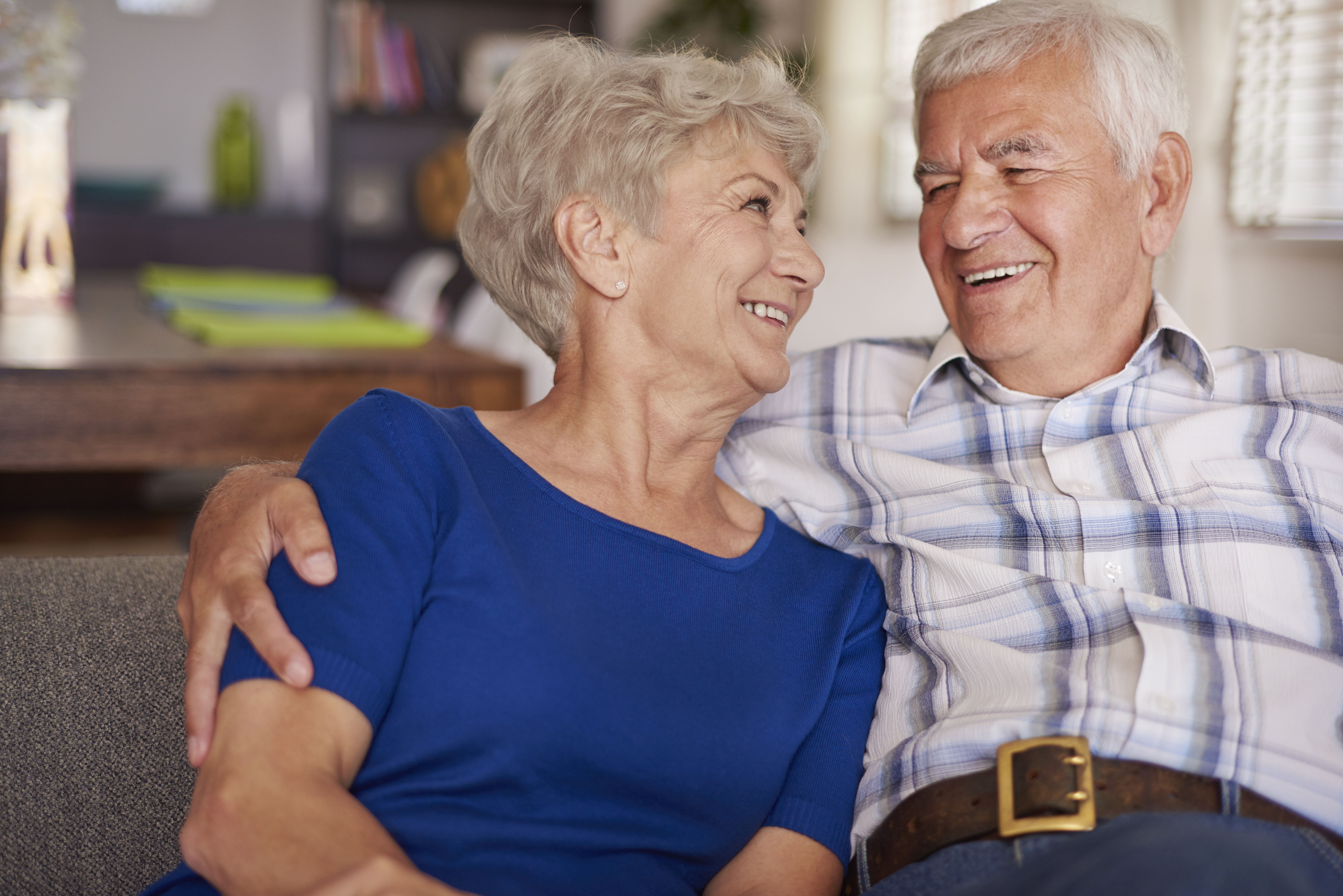 An elderly couple looking at each other while smiling. | Source: Shutterstock