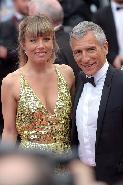 Nagui Fam et Mélanie Page assistent à la projection de "Les Plus Belles Annees D'Une Vie" lors du 72ème Festival de Cannes le 18 mai 2019 à Cannes, France. | Photo : Getty Images