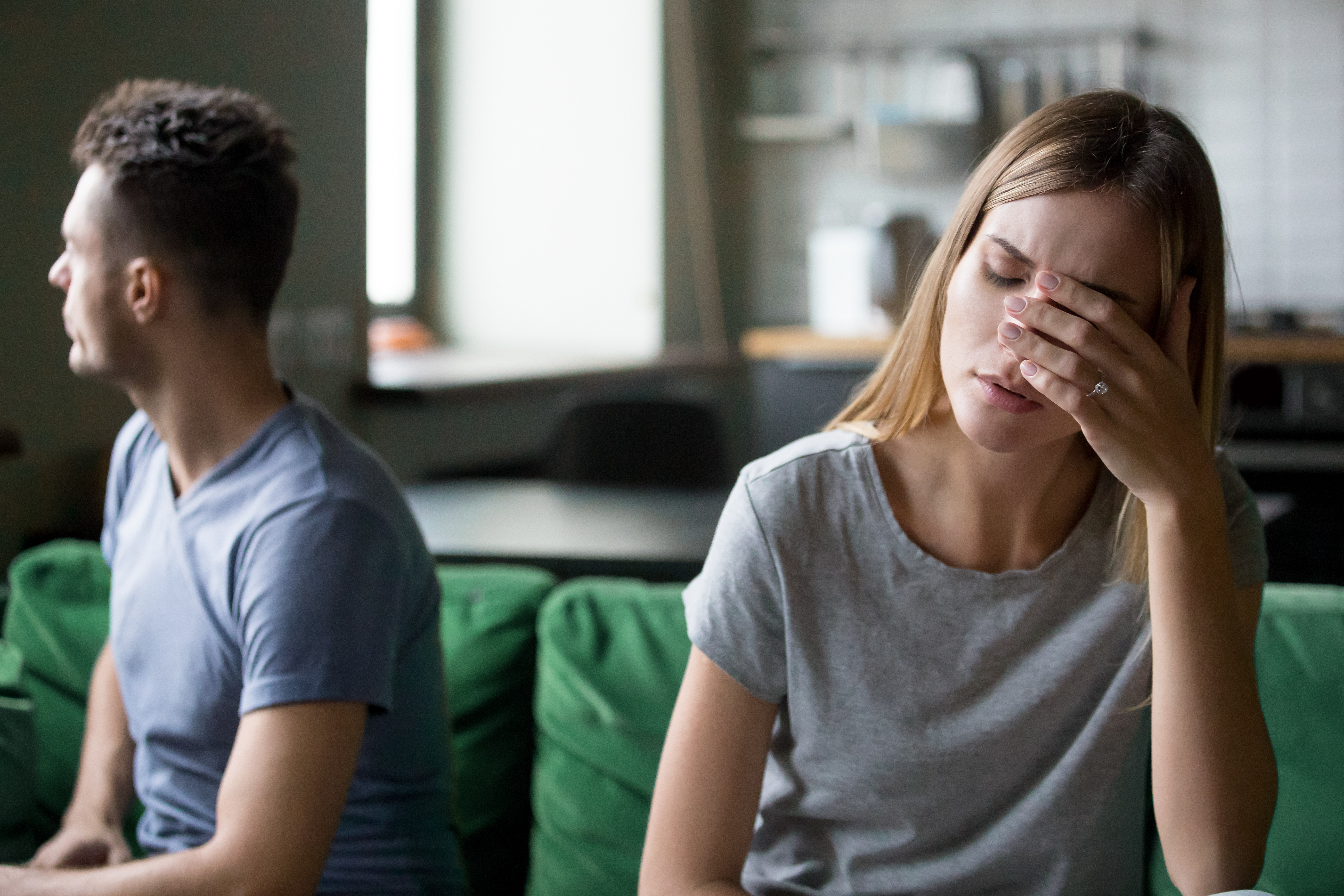 A woman feeling tired and frustrated after an argument with her husband | Source: Shutterstock