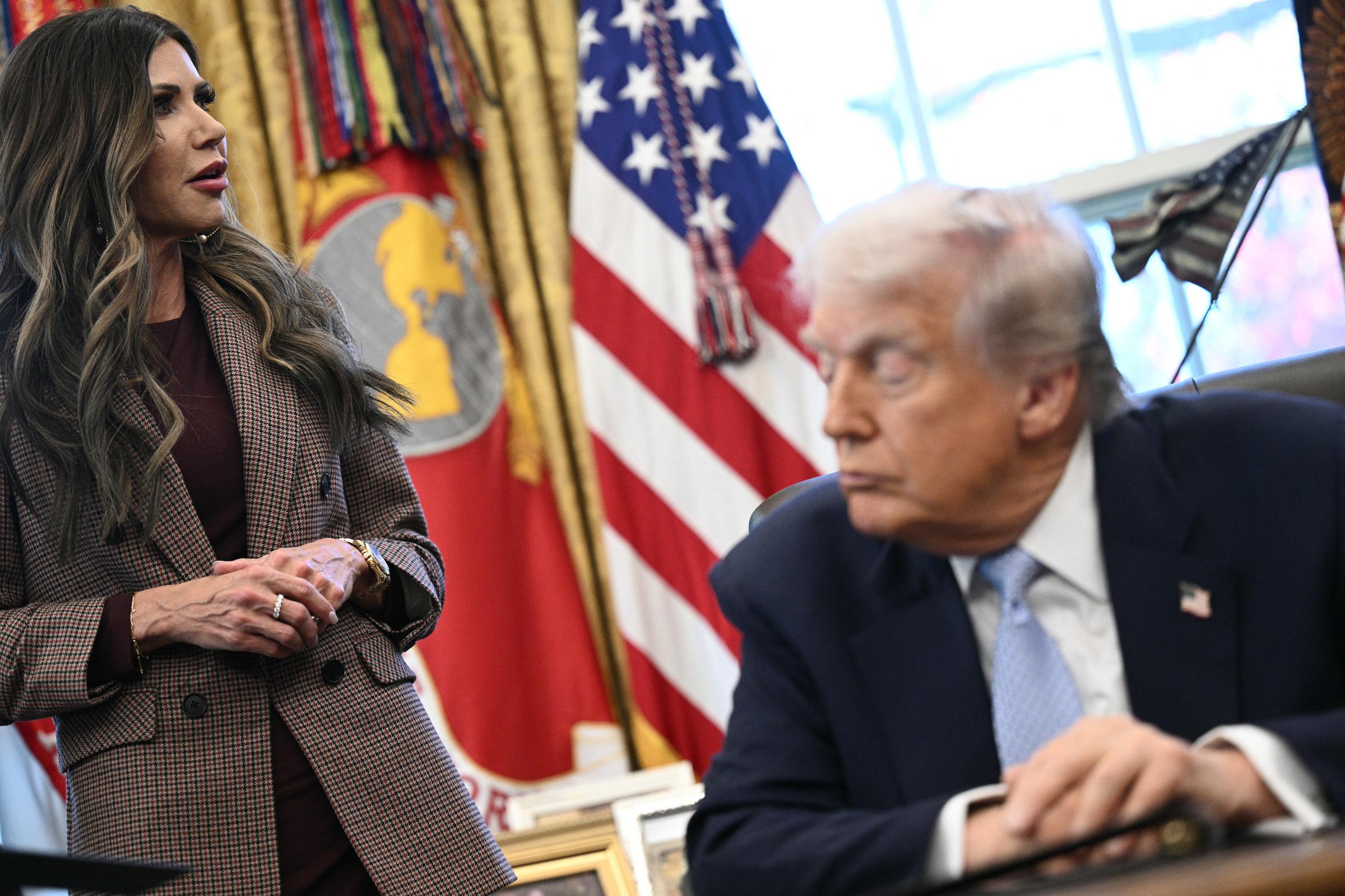 Kristi Noem speaks as Donald Trump listens during a meeting at the White House on November 17, 2025 | Source: Getty Images