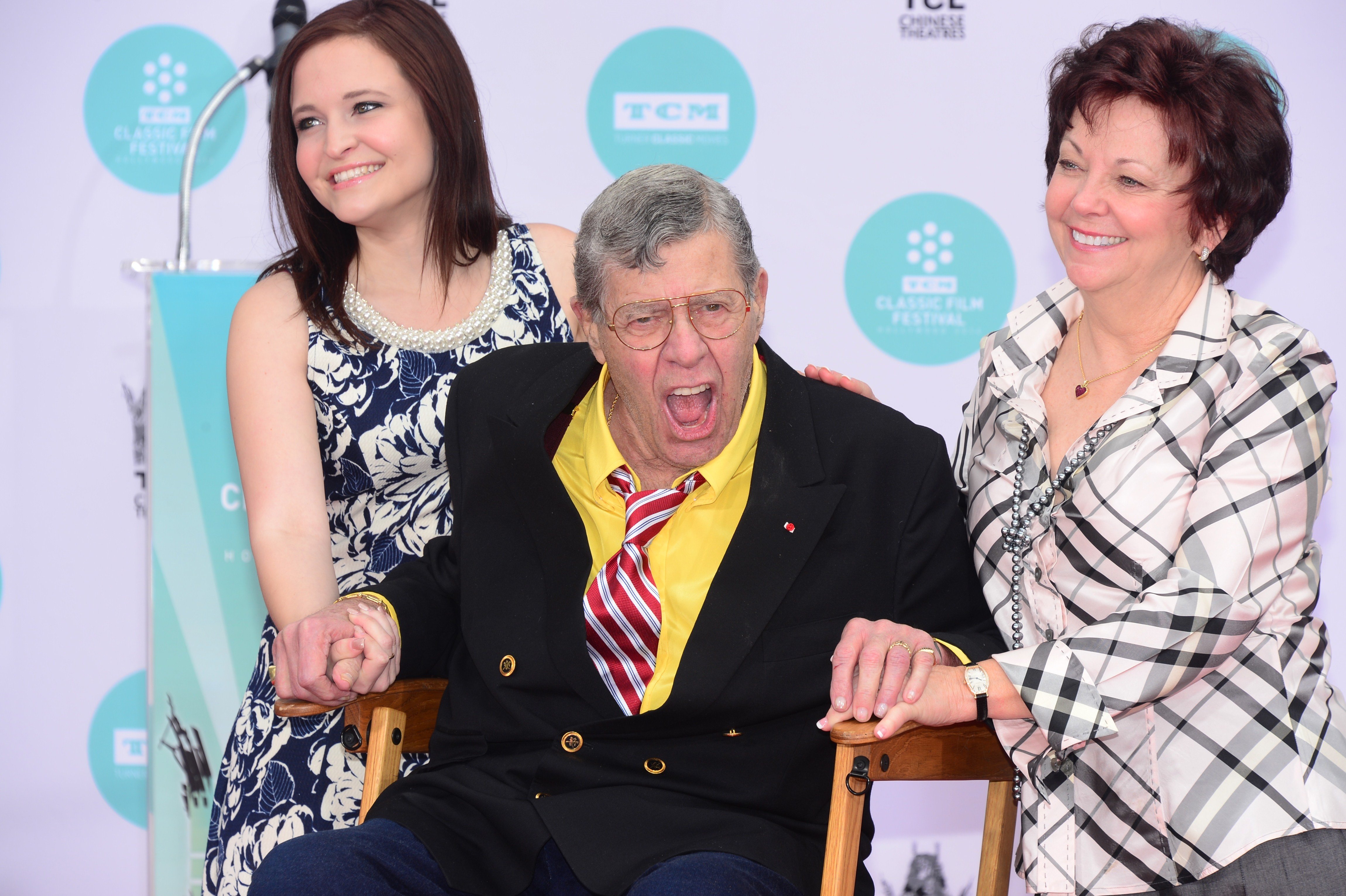 Jerry Lewis poses with SanDee Pitnick and daughter Danielle at his Hand and Footprint ceremony held at the TCL Theater on April 12, 2014 in Hollywood, California.  / Source: Getty Images