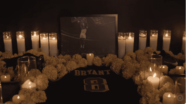 Candles and flowers around Kobe Bryant's jersey back in November 2016 | Source: YouTube/The Ringer
