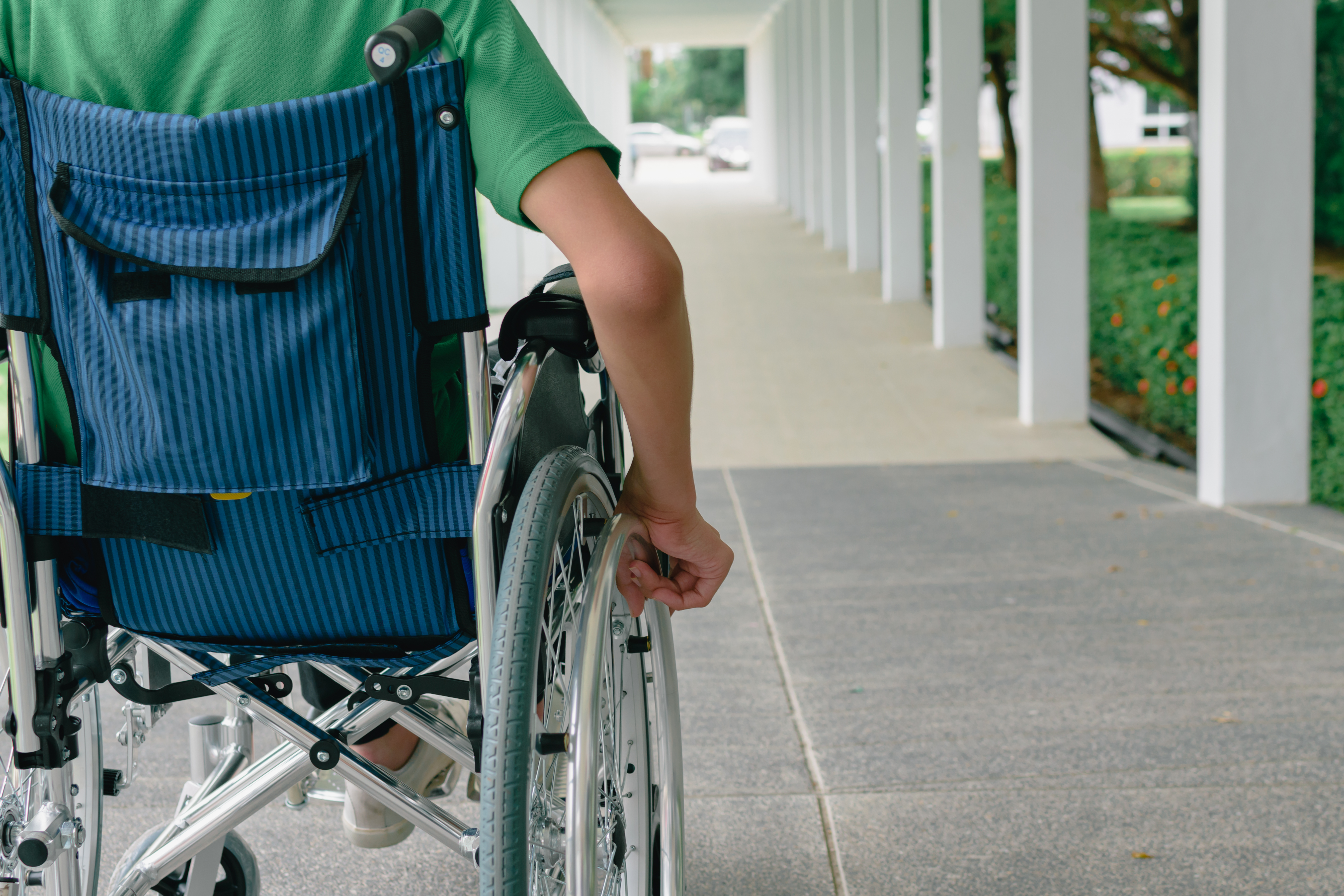 Boy in a wheelchair | Source: Shutterstock.com