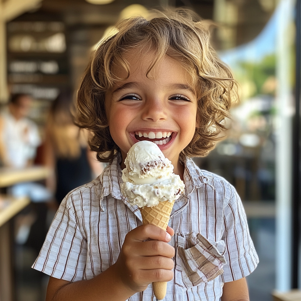 A little boy holding an ice cream | Source: Midjourney