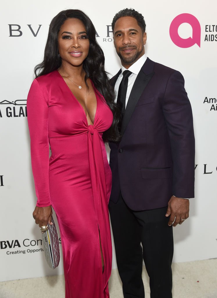 Kenya Moore and Marc Daly attend the 26th annual Elton John AIDS Foundation's Academy Awards Viewing Party at The City of West Hollywood Park | Photo: Getty Images
