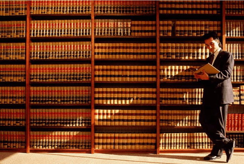 Lawyer reading in a library | Source: Getty Images