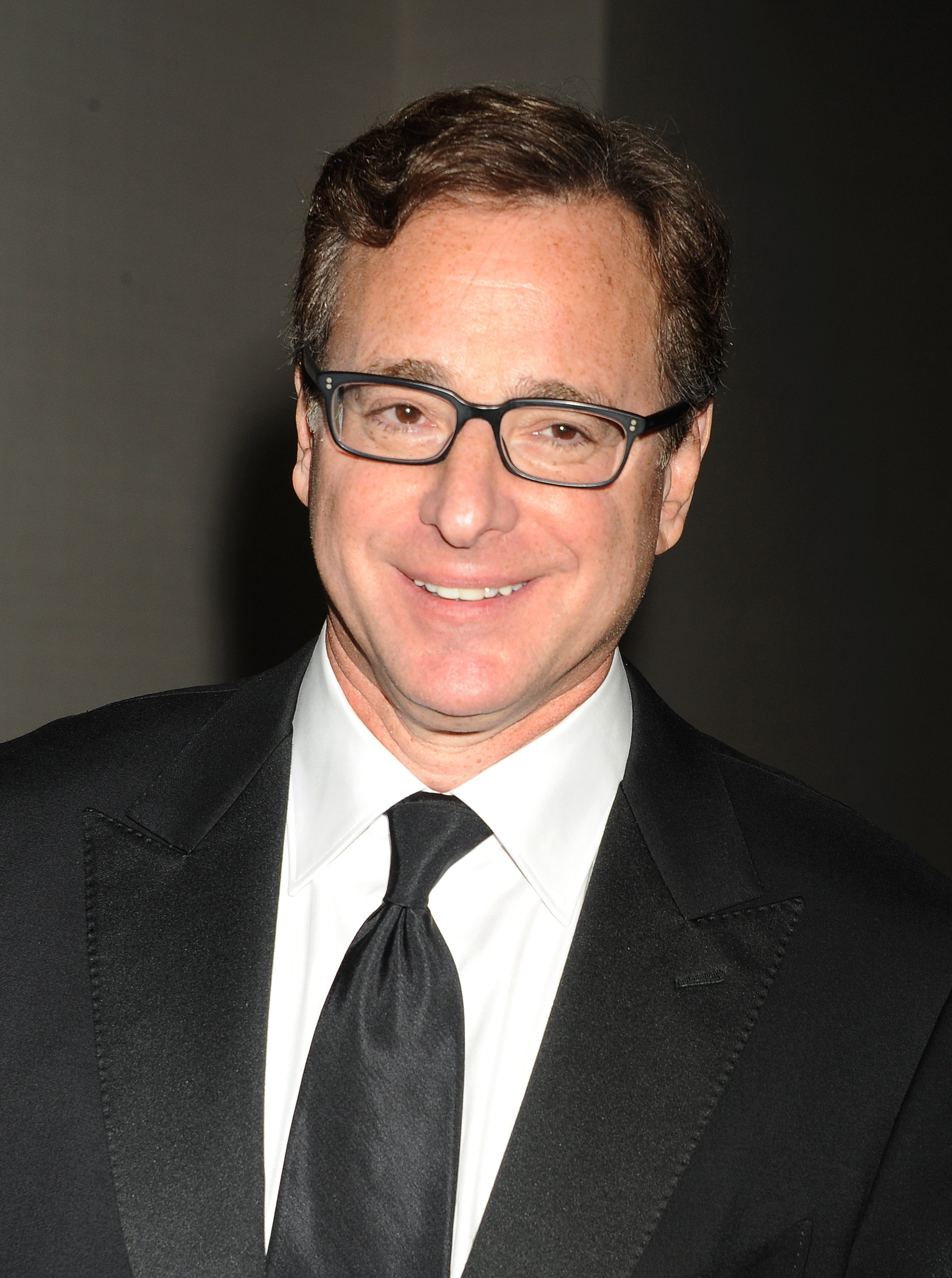 Bob Saget poses during the 2015 Writers Guild Awards L.A. Ceremony at the Hyatt Regency Century Plaza on February 14, 2015 in Century City, California | Source: Getty Images 