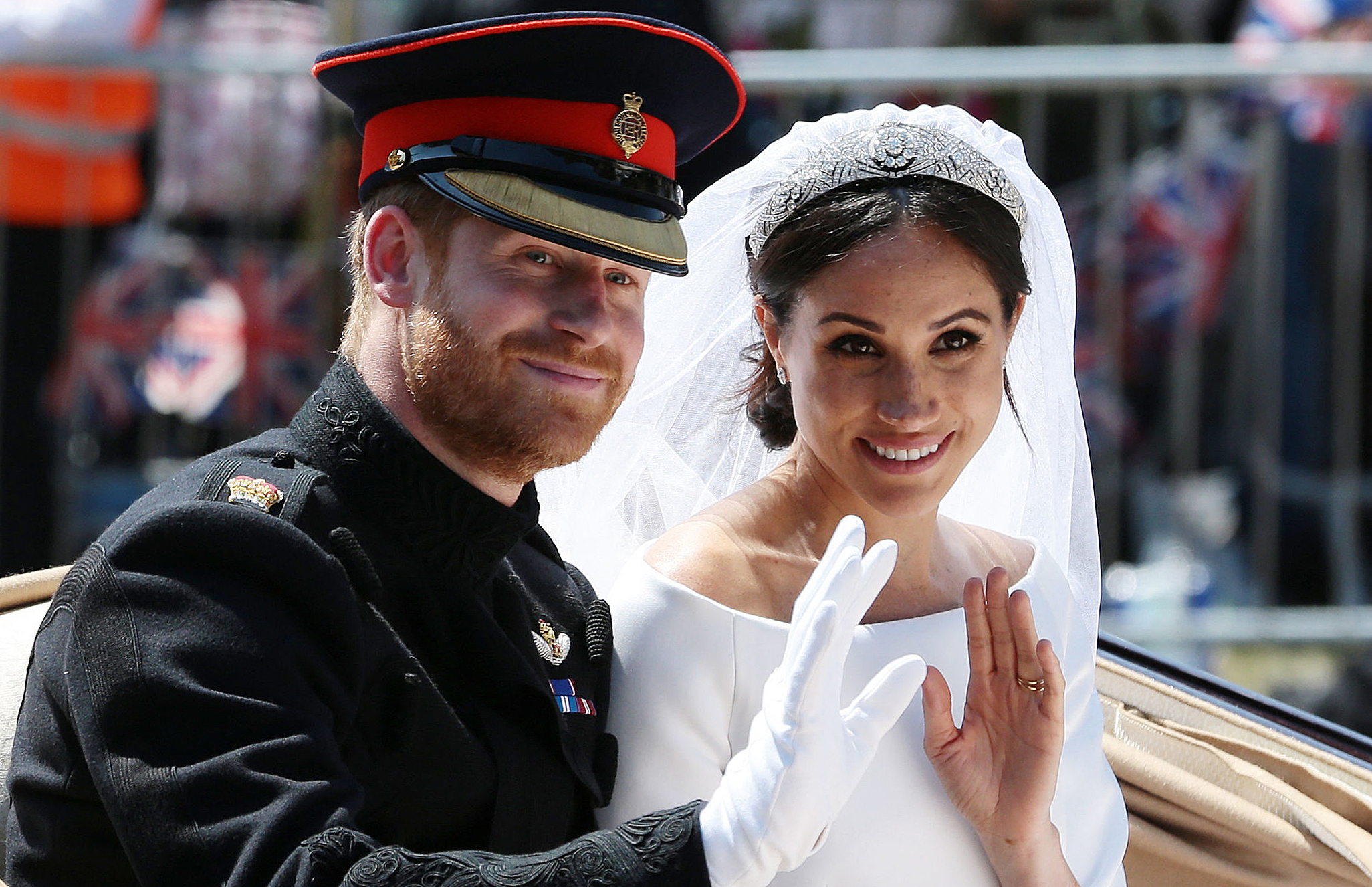 Prince Harry and Meghan Markle wave from the Ascot Landau Carriage on May 19, 2018, in Windsor, England. | Source: Getty Images