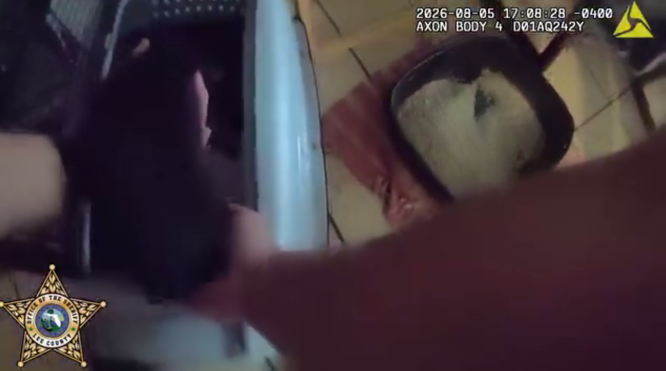 Bodycam footage showing officer placing Luna, the kitten, in a carrier, posted on August 6, 2026. | Source: Facebook/Lee County Sheriff's Office