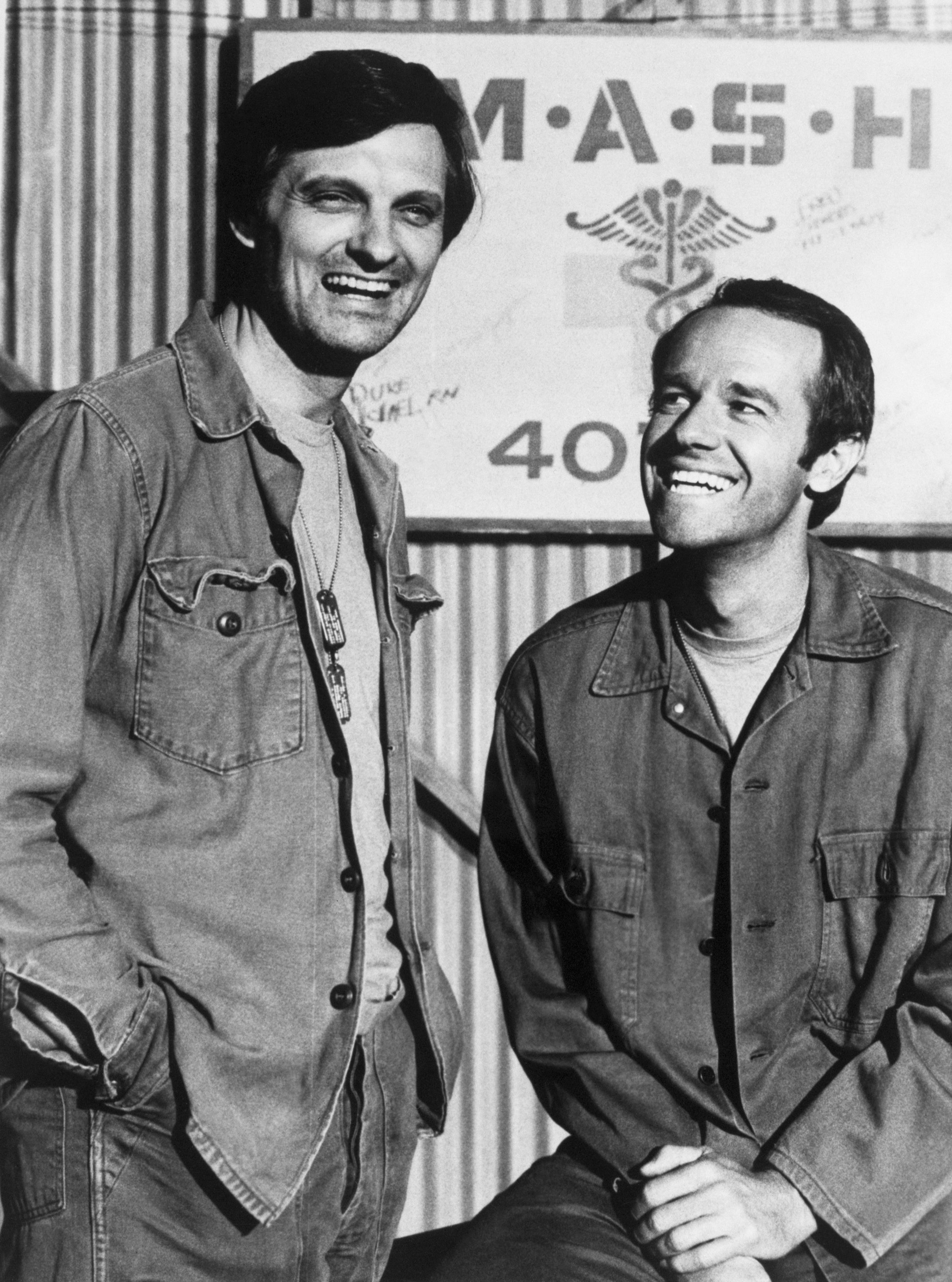 Alan Alda and Mike Farrell pictured in onset for "M*A*S*H." | Source: Getty Images 