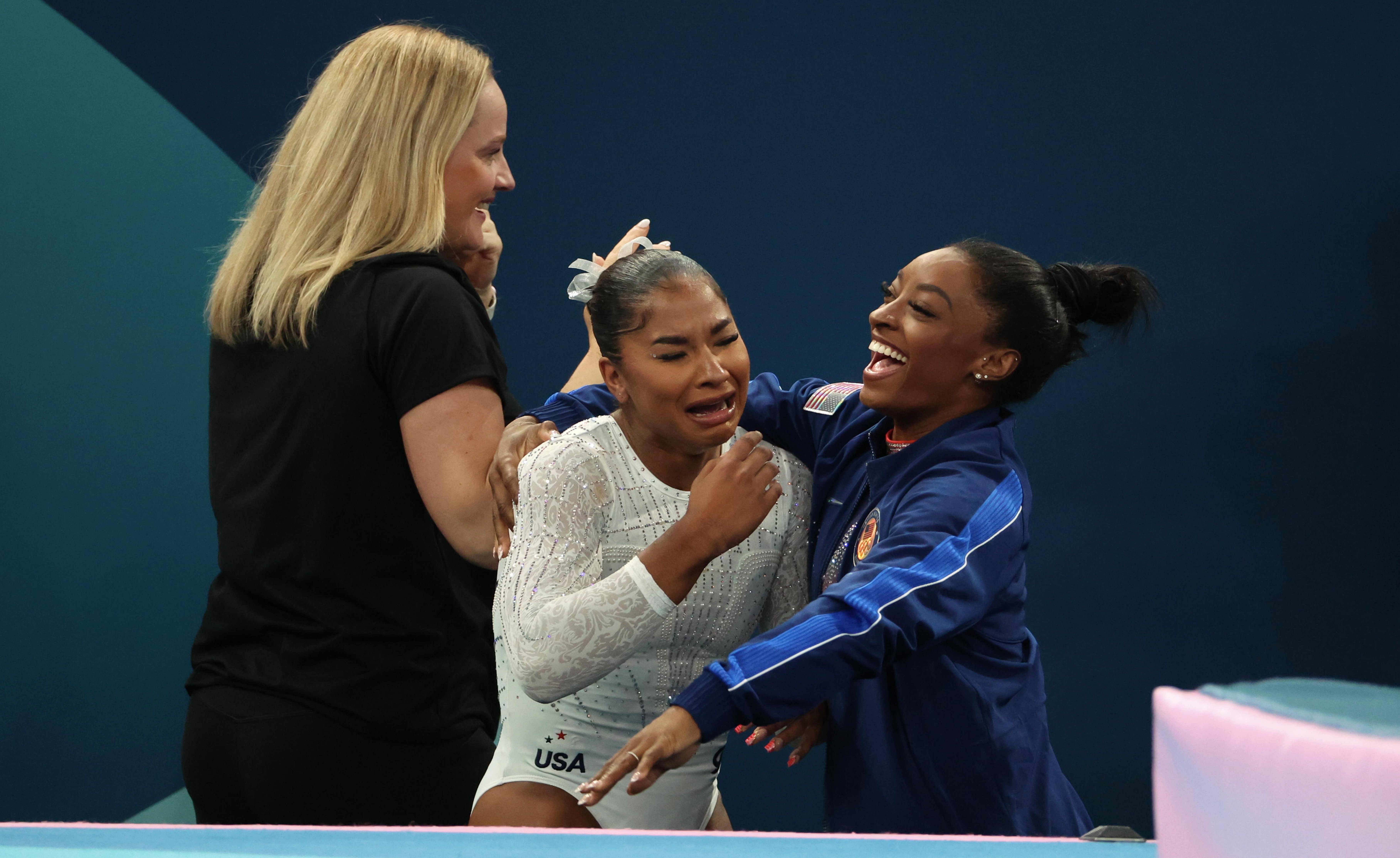 Jordan Chiles reacts as Simone Biles hugs her after the Women's Floor Exercise Final at the 2024 Paris Olympics on August 5, 2024 | Source: Getty Images