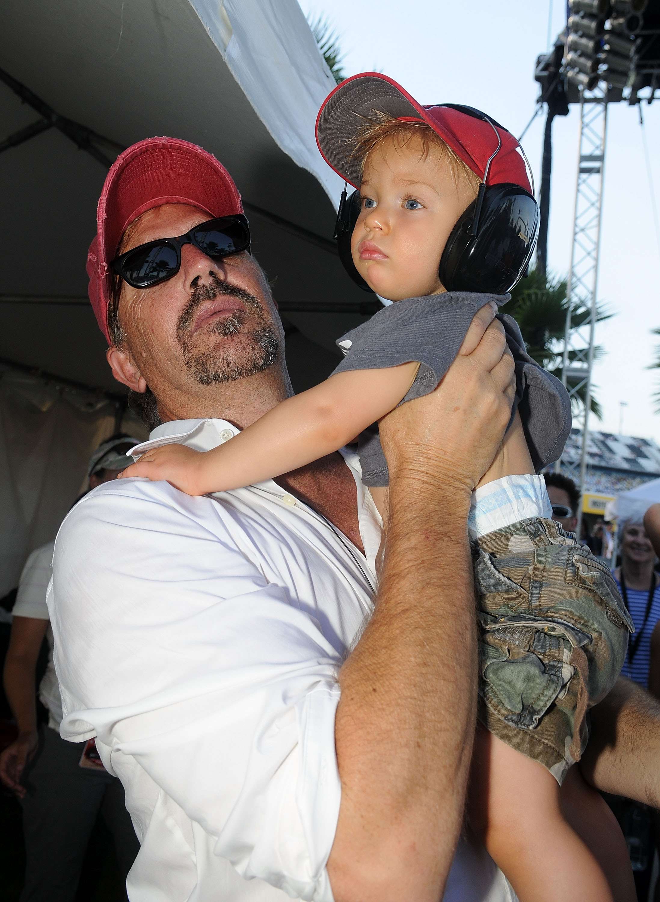 Kevin Costner and his son Cayden Costner during the Sprint Fan Zone before the NASCAR Sprint Cup Series Coke Zero 400 at Daytona International Speedway on July 5, 2008 in Daytona Beach, Florida | Source: Getty Images