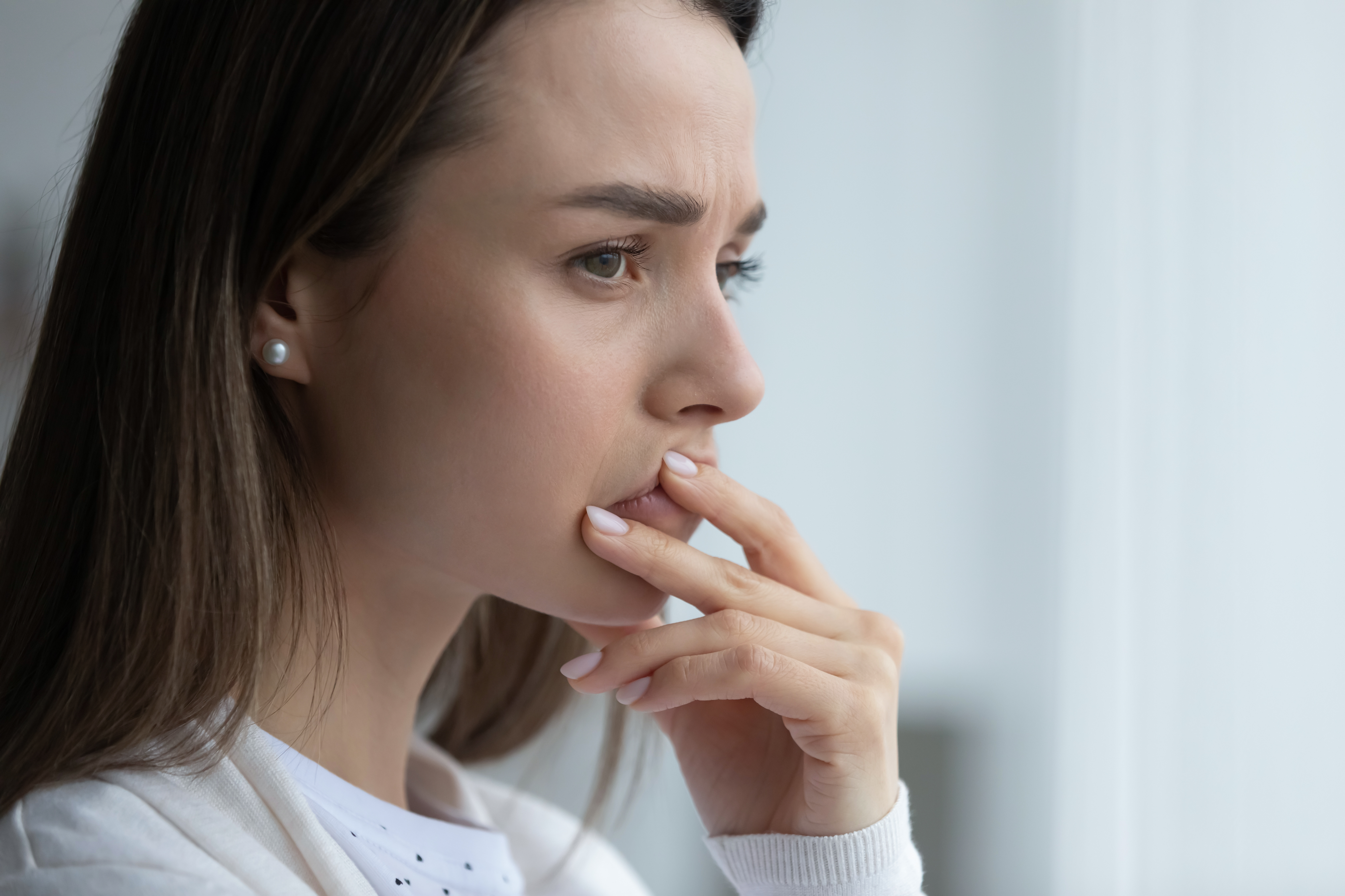 Woman feeling doubtful about a hard decision | Source: Shutterstock