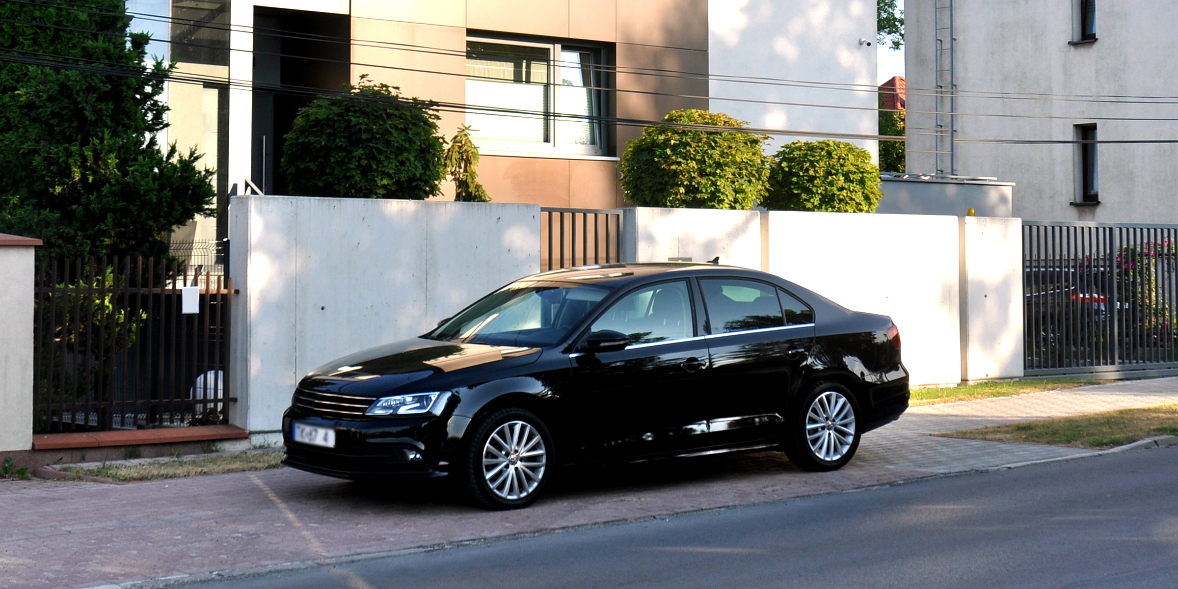 A car parked near a house | Source: Shutterstock