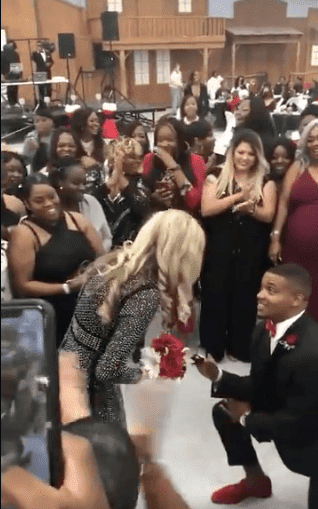 Solomon McGuinty gets down on one knee and proposes to his girlfriend during his sister's wedding. | Source: twitter/devon0jones