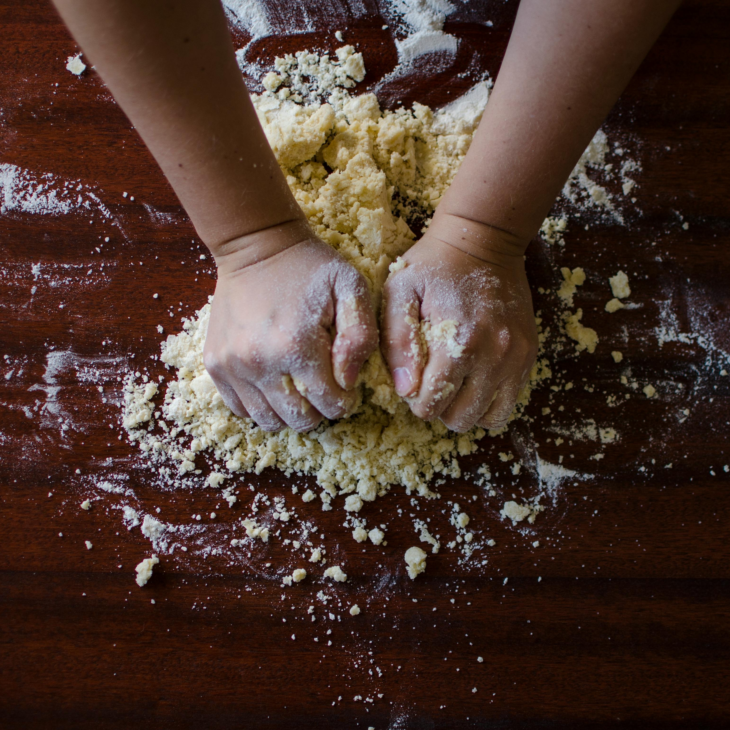 A pair of hands preparing pastry dough | Source: Midjourney