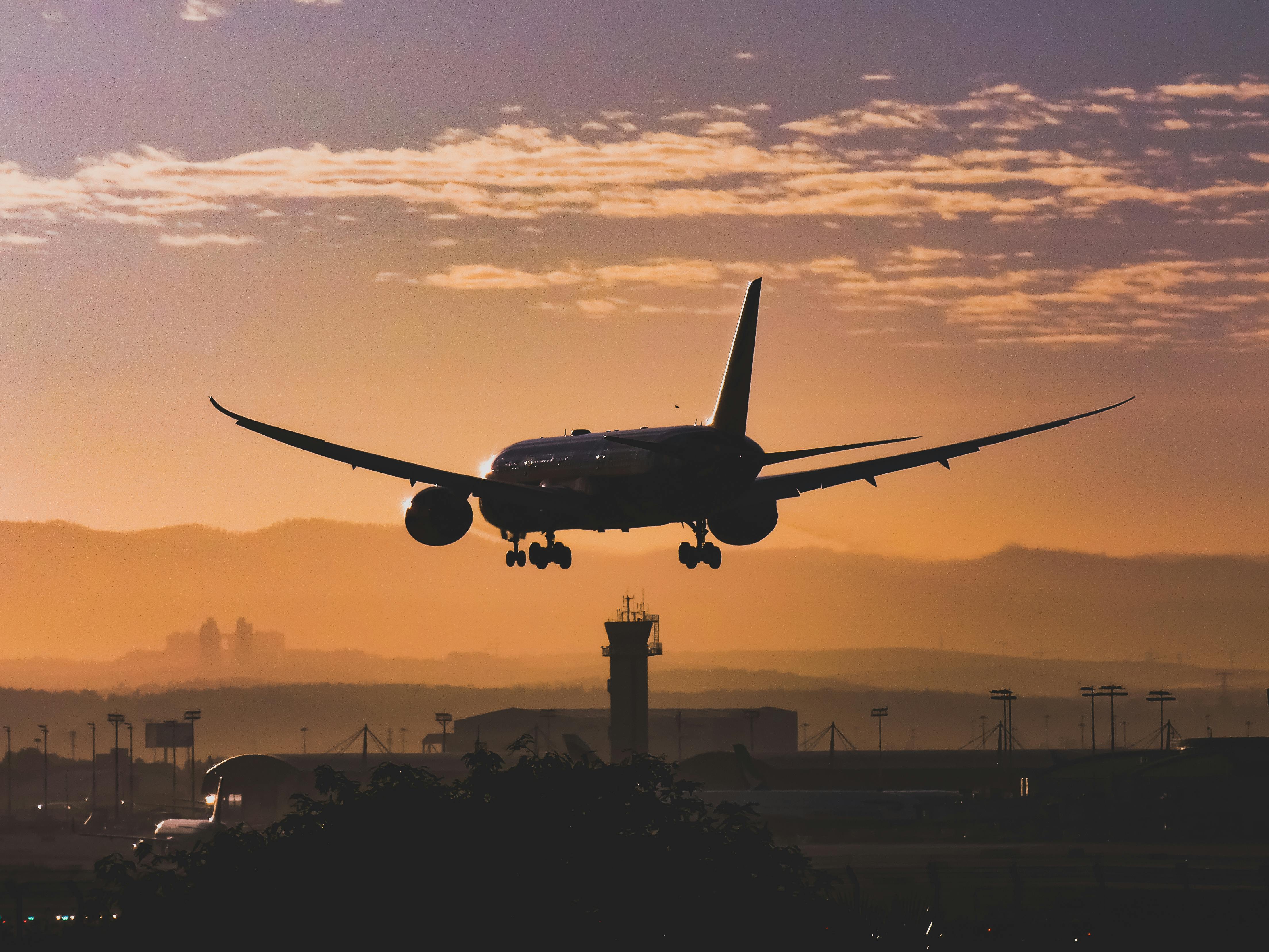 Plane landing during sunset | Source: Pexels
