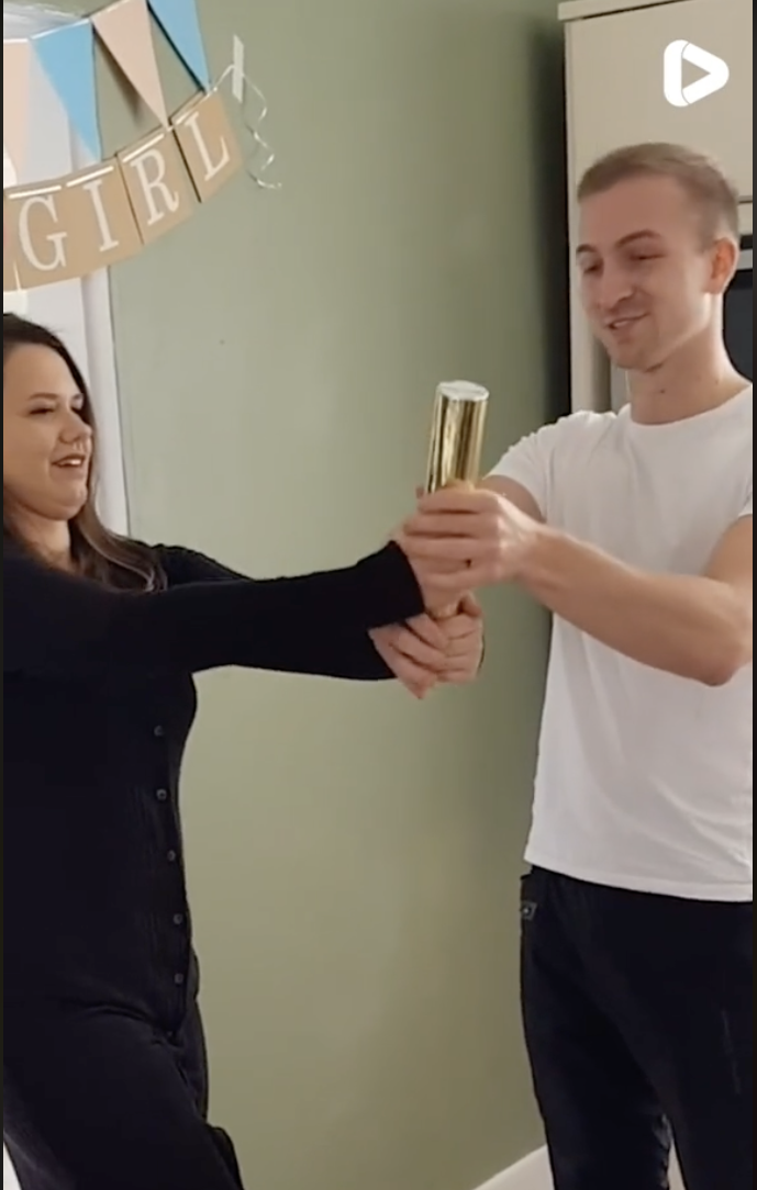 A couple at their child's gender reveal party | Source: tiktok.com/@itsgoneviral