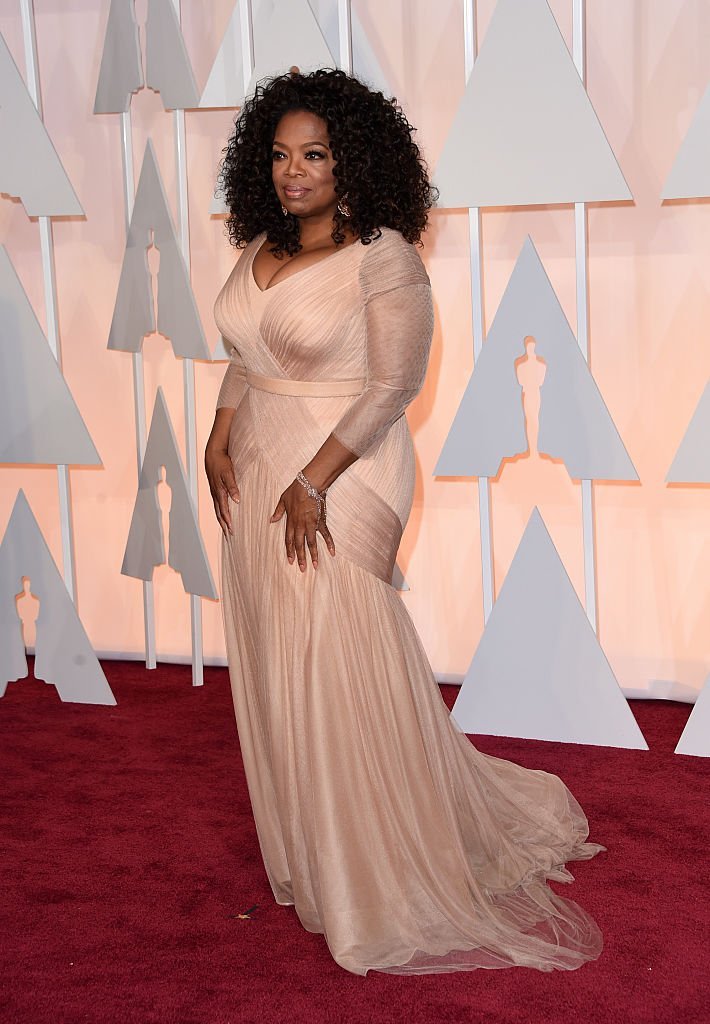 Oprah Winfrey attending the 87th Academy Awards on February 22, 2015. More than three decades ago, she was nominated for Best Supporting Actress for her role in "The Color Purple" but lost to Anjelica Huston. | Source: Getty