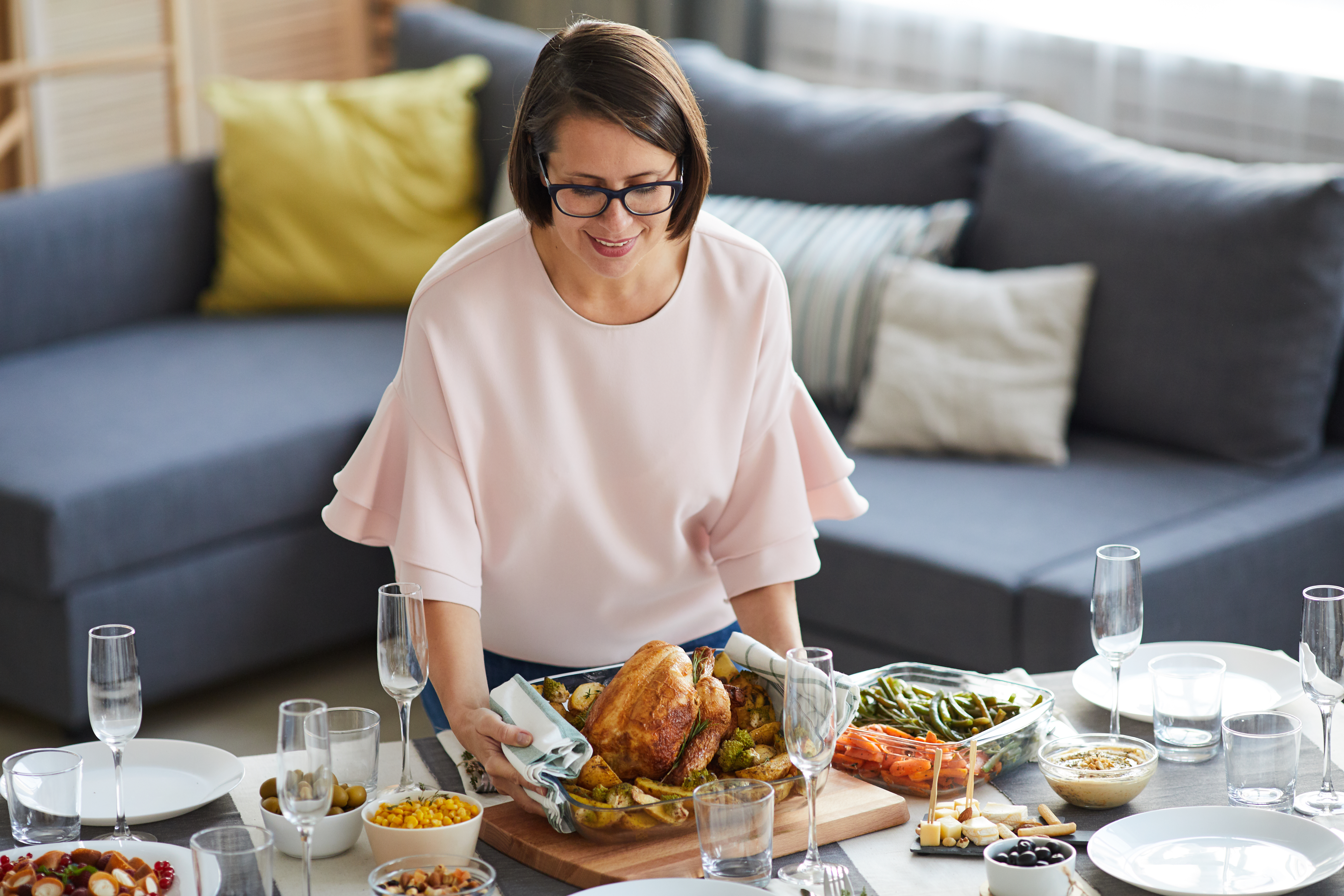 A woman serves the dinner | Source: Shutterstock