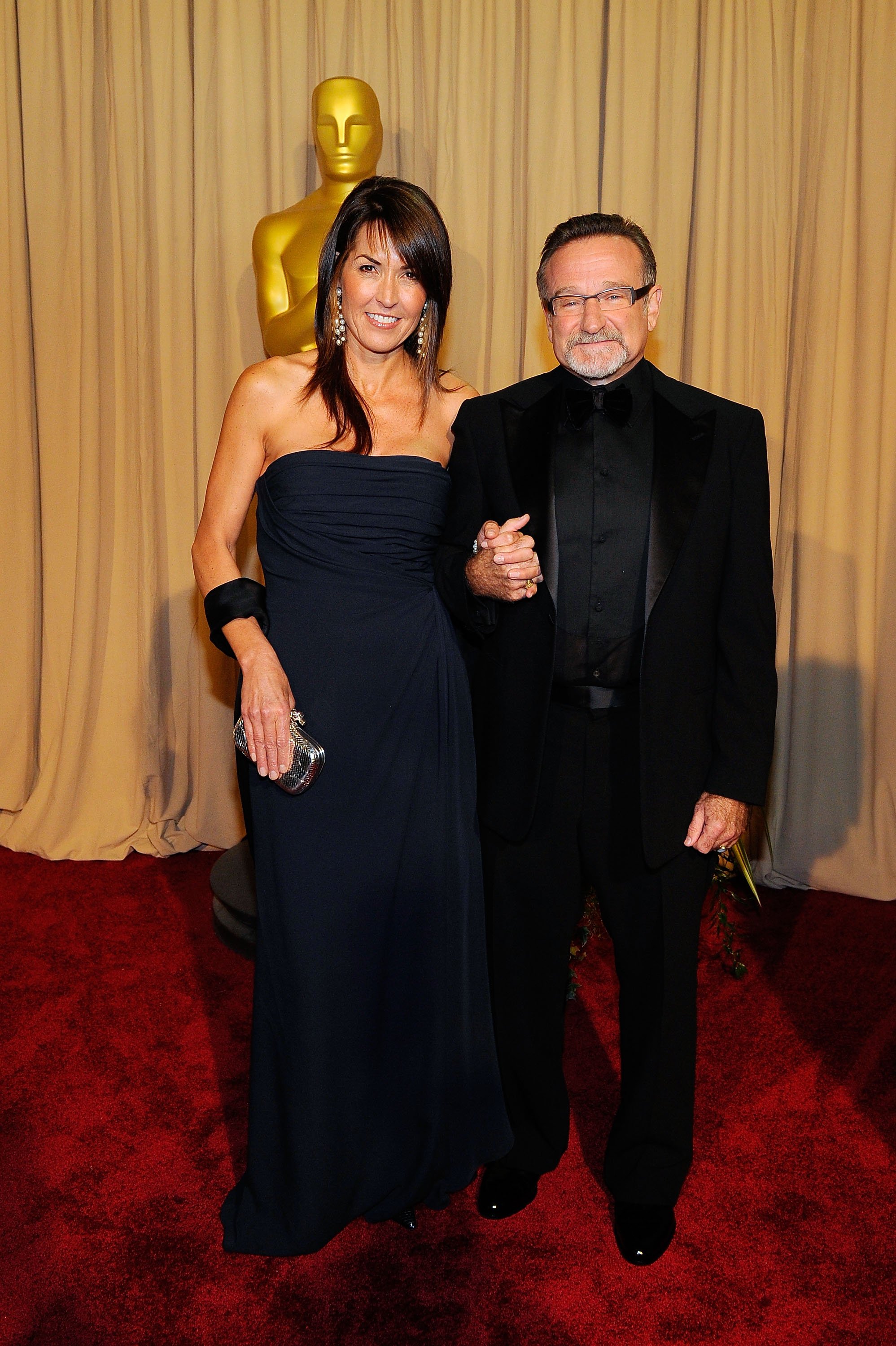 Robin Williams and Susan Schneider arrive backstage at the 82nd Annual Academy Awards held at Kodak Theatre on March 7, 2010 in Hollywood, California. | Source: Getty Images 
