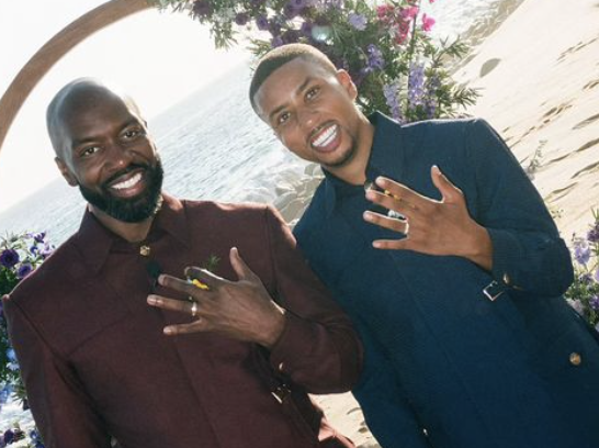 Greg Mathis Jr. and Elliott Cooper showing off their rings on their wedding day posted on October 24, 2024 | Source: Instagram/mc_weddings