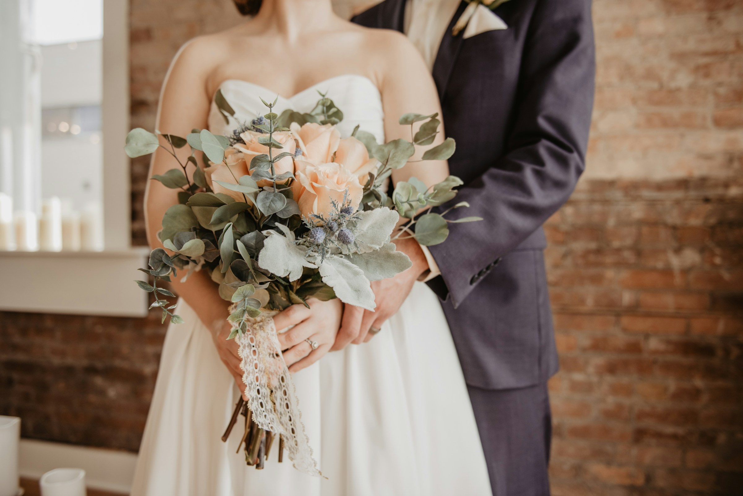 A bride and groom holding hands | Source: Unsplash