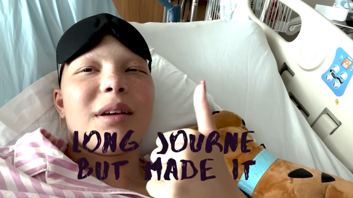 Isabella Strahan smiles and gives a thumbs-up as she announces she has completed her chemotherapy, June 2024. | Source: YouTube/IsabellaStrahan