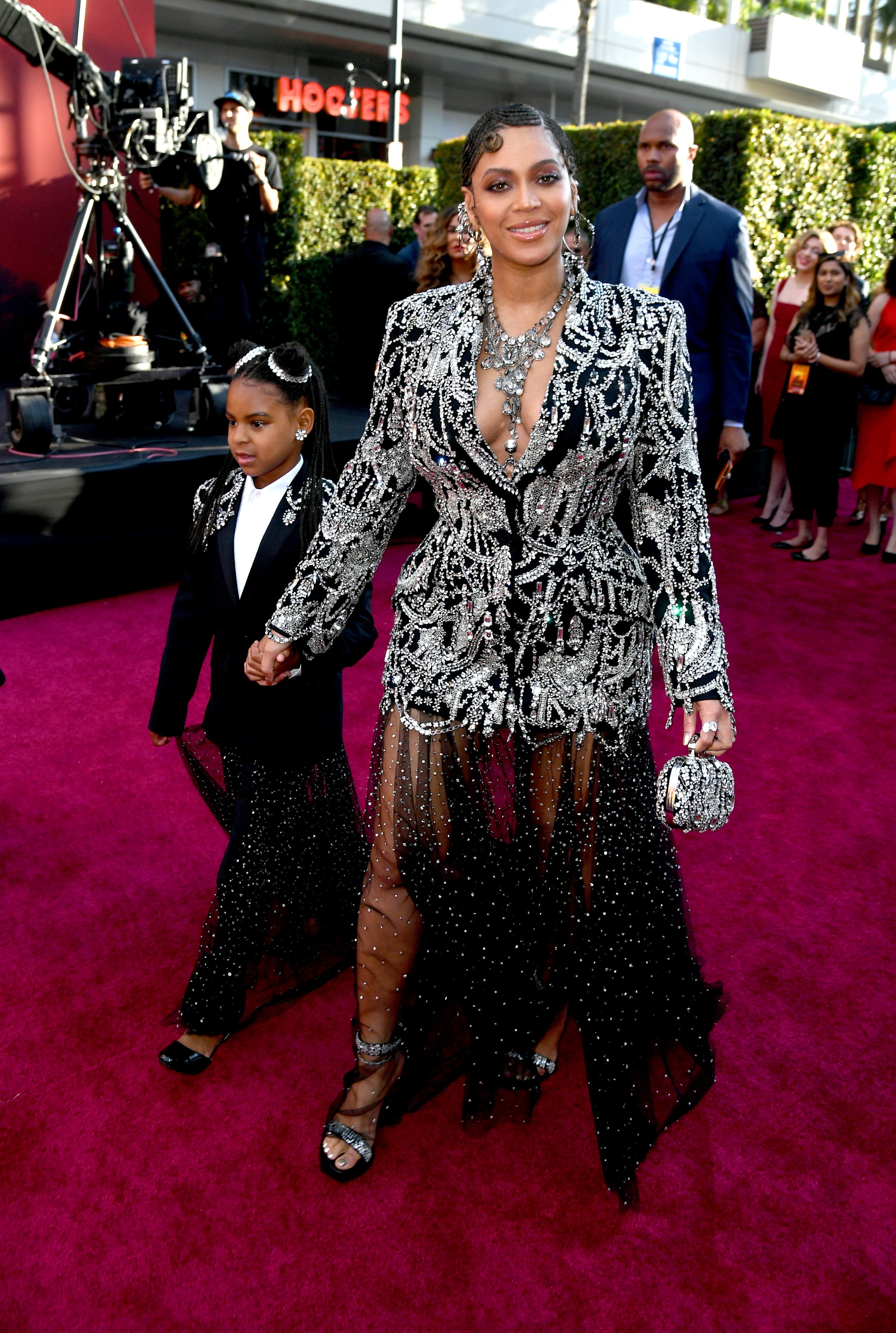 Blue Ivy Carter escorts her mother, Beyonce Knowles at the Hollywood premiere of "The Lion King" where the singer portrays Nala. | Source: Getty