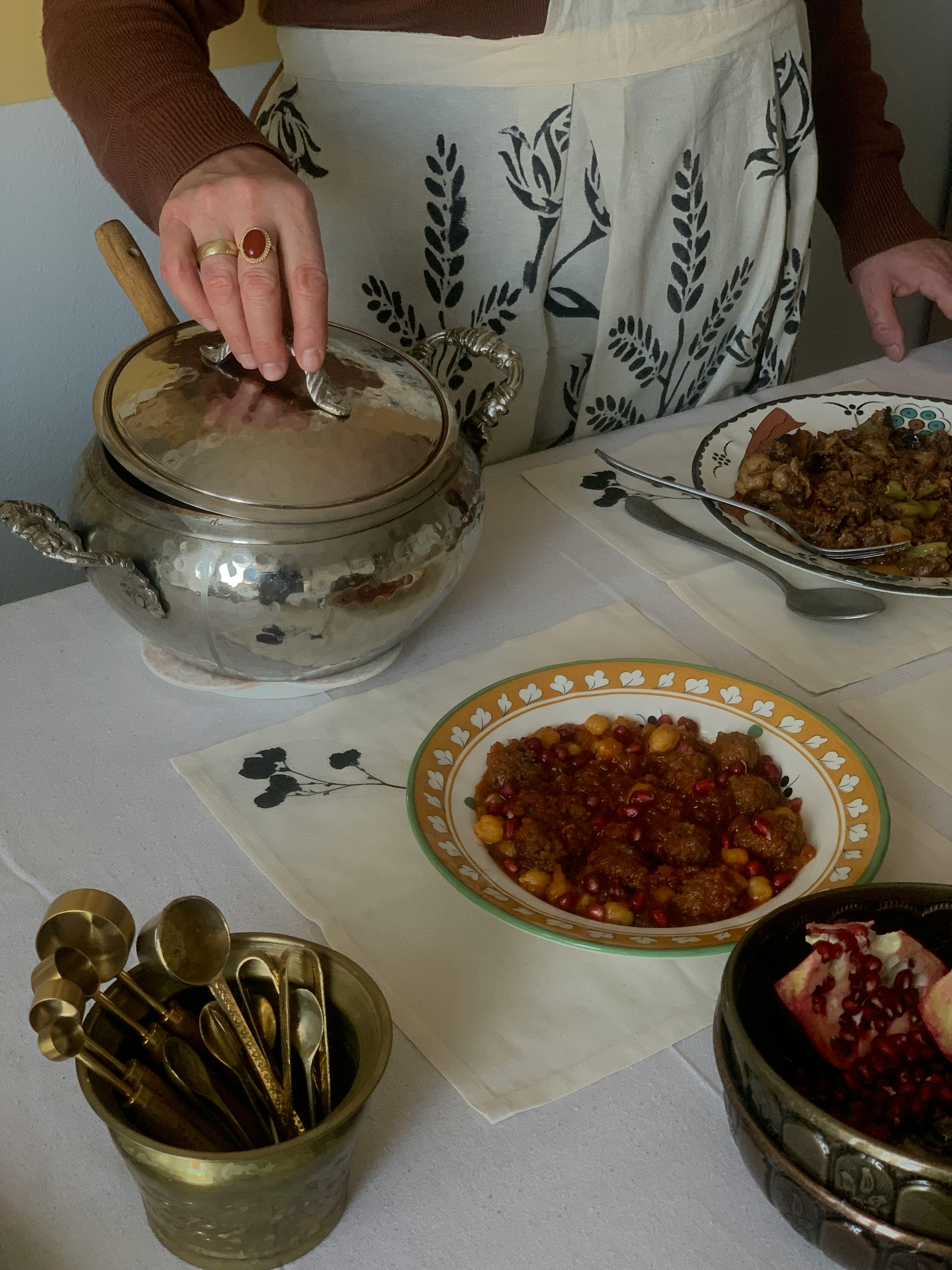 Meal on a table with a person standing nearby | Source: Pexels